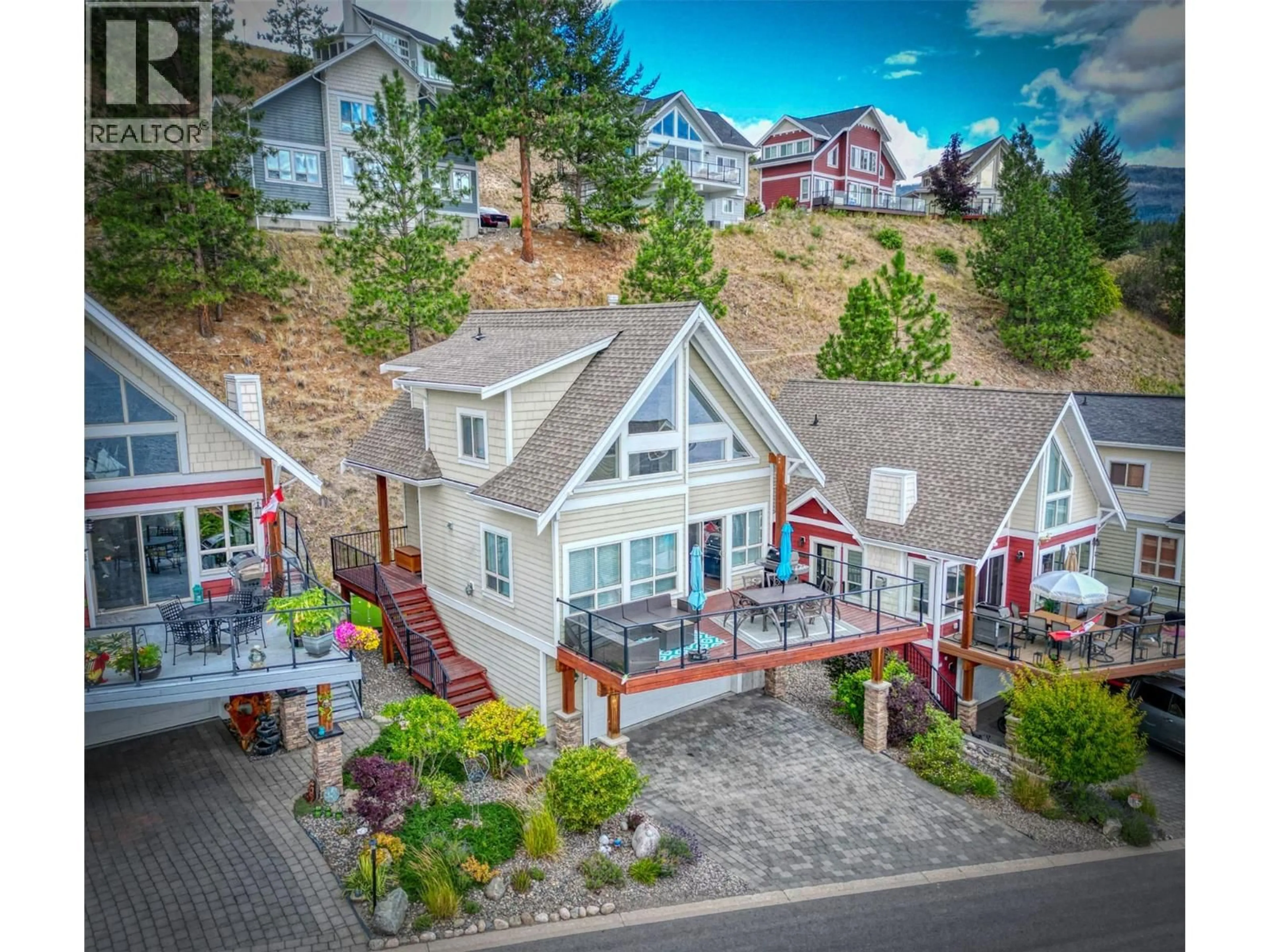 A pic from outside/outdoor area/front of a property/back of a property/a pic from drone, water/lake/river/ocean view for 52 - 6920 BARCELONA DRIVE, Kelowna British Columbia V1Z3R8