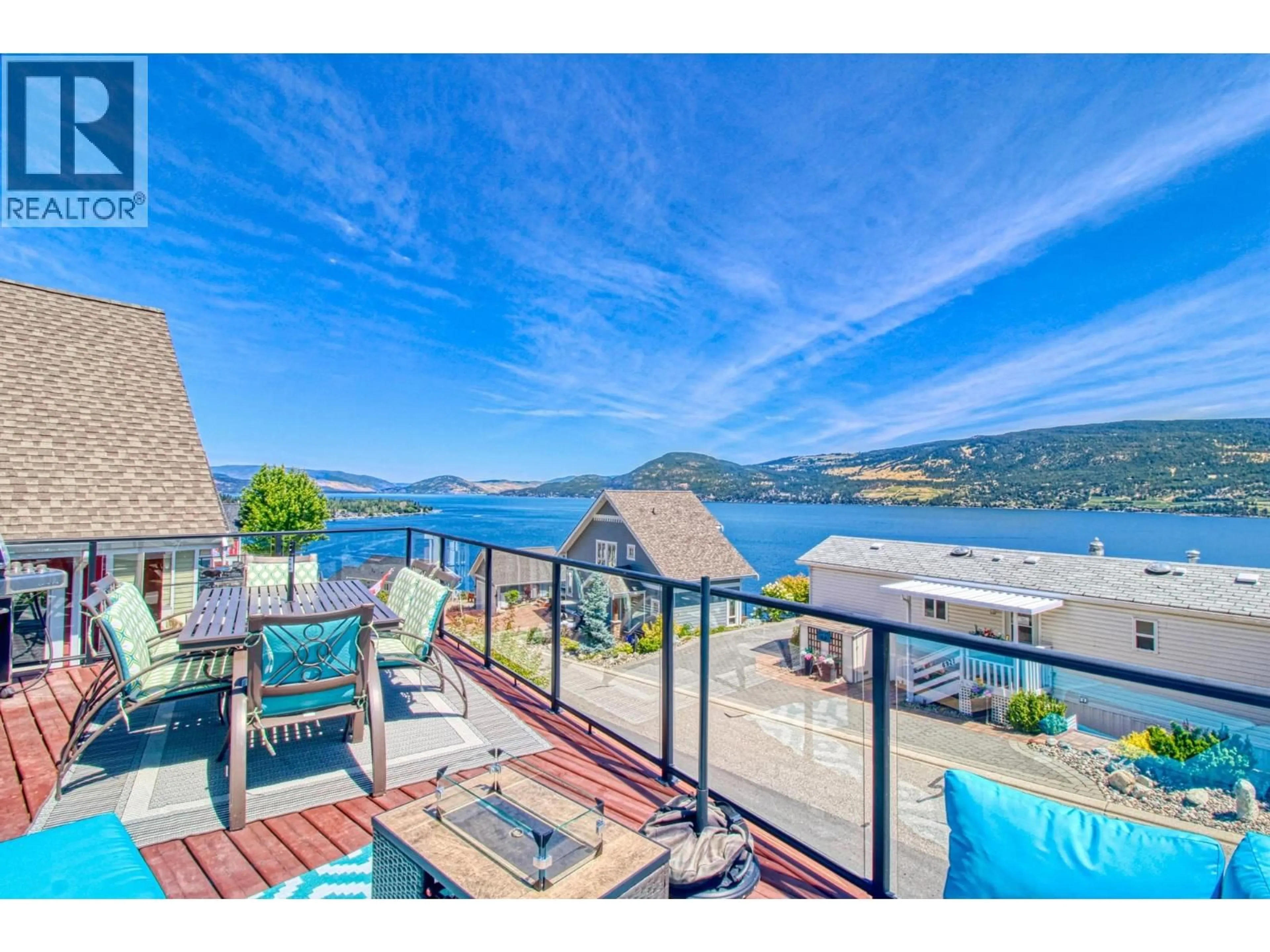 A pic from outside/outdoor area/front of a property/back of a property/a pic from drone, water/lake/river/ocean view for 52 - 6920 BARCELONA DRIVE, Kelowna British Columbia V1Z3R8