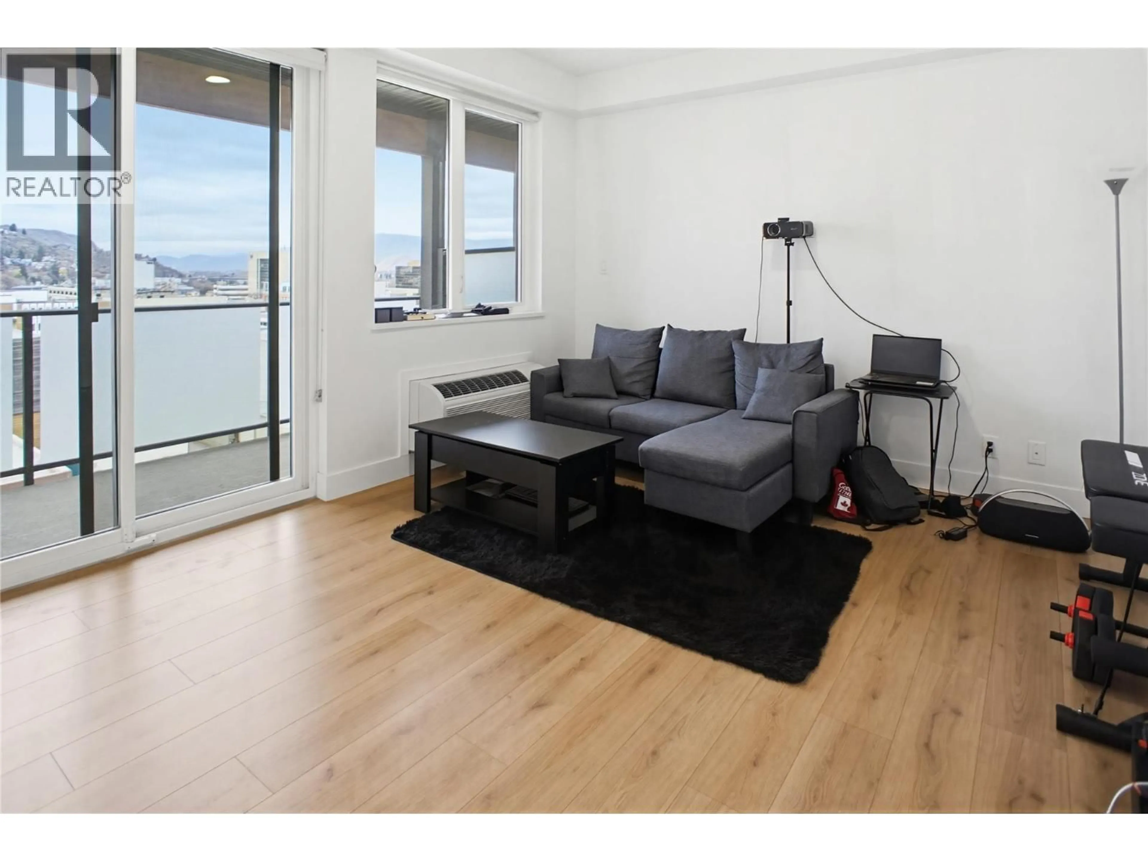 Living room with furniture, wood/laminate floor for 511 - 444 ST PAUL STREET, Kamloops British Columbia V2C0L2