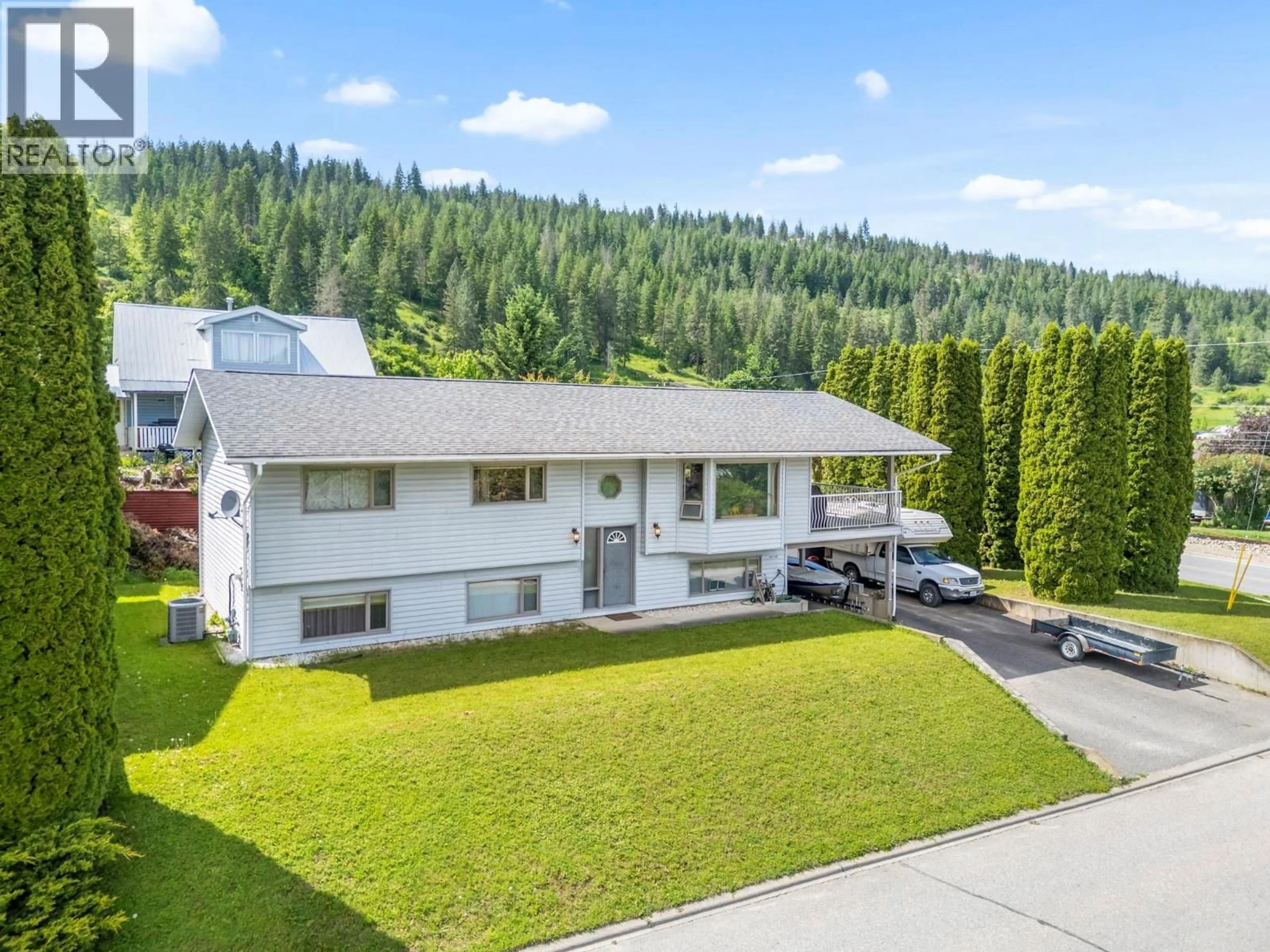 A pic from outside/outdoor area/front of a property/back of a property/a pic from drone, mountain view for 4 PRESTON CRESCENT, Enderby British Columbia V4Y4C5