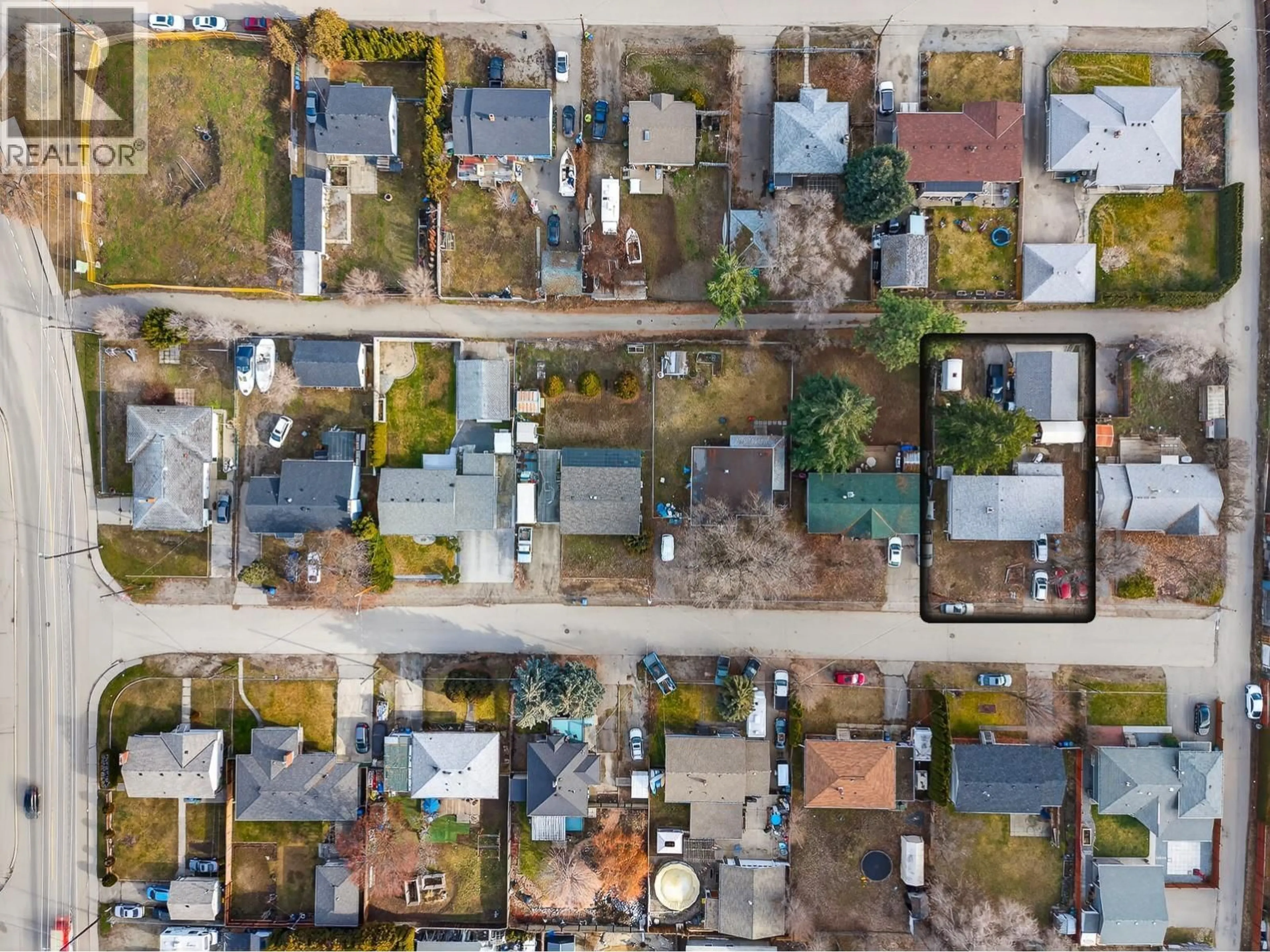 A pic from outside/outdoor area/front of a property/back of a property/a pic from drone, street for 465 DONHAUSER ROAD, Kelowna British Columbia V1X3G2