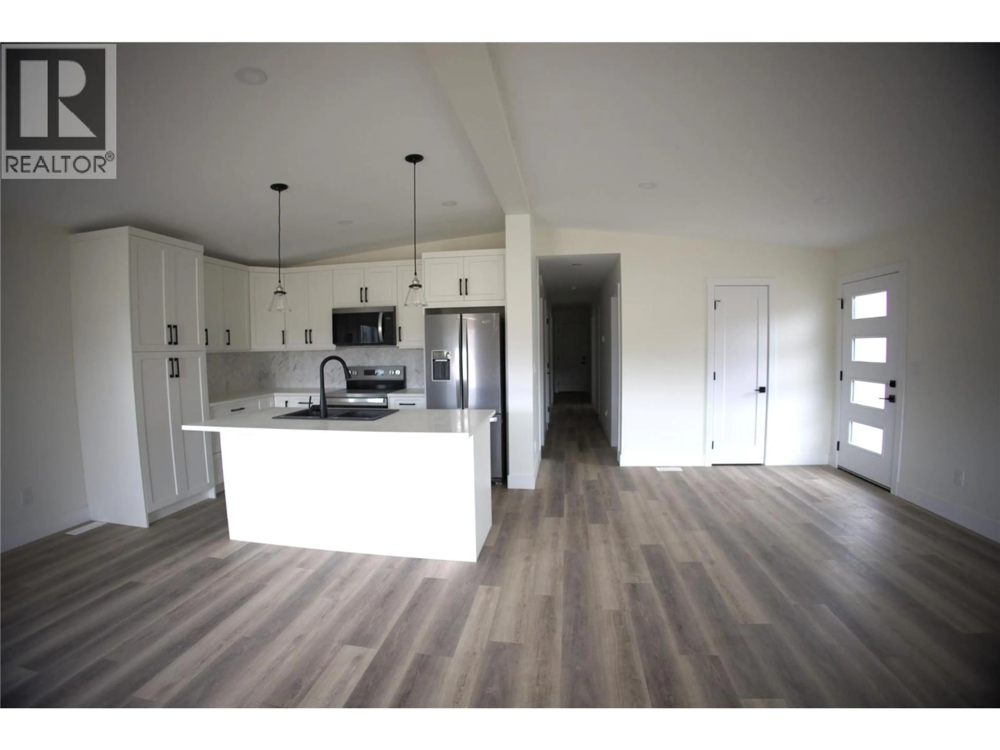 Open concept kitchen, wood/laminate floor for 6830 22ND STREET, Grand Forks British Columbia V0H1H0