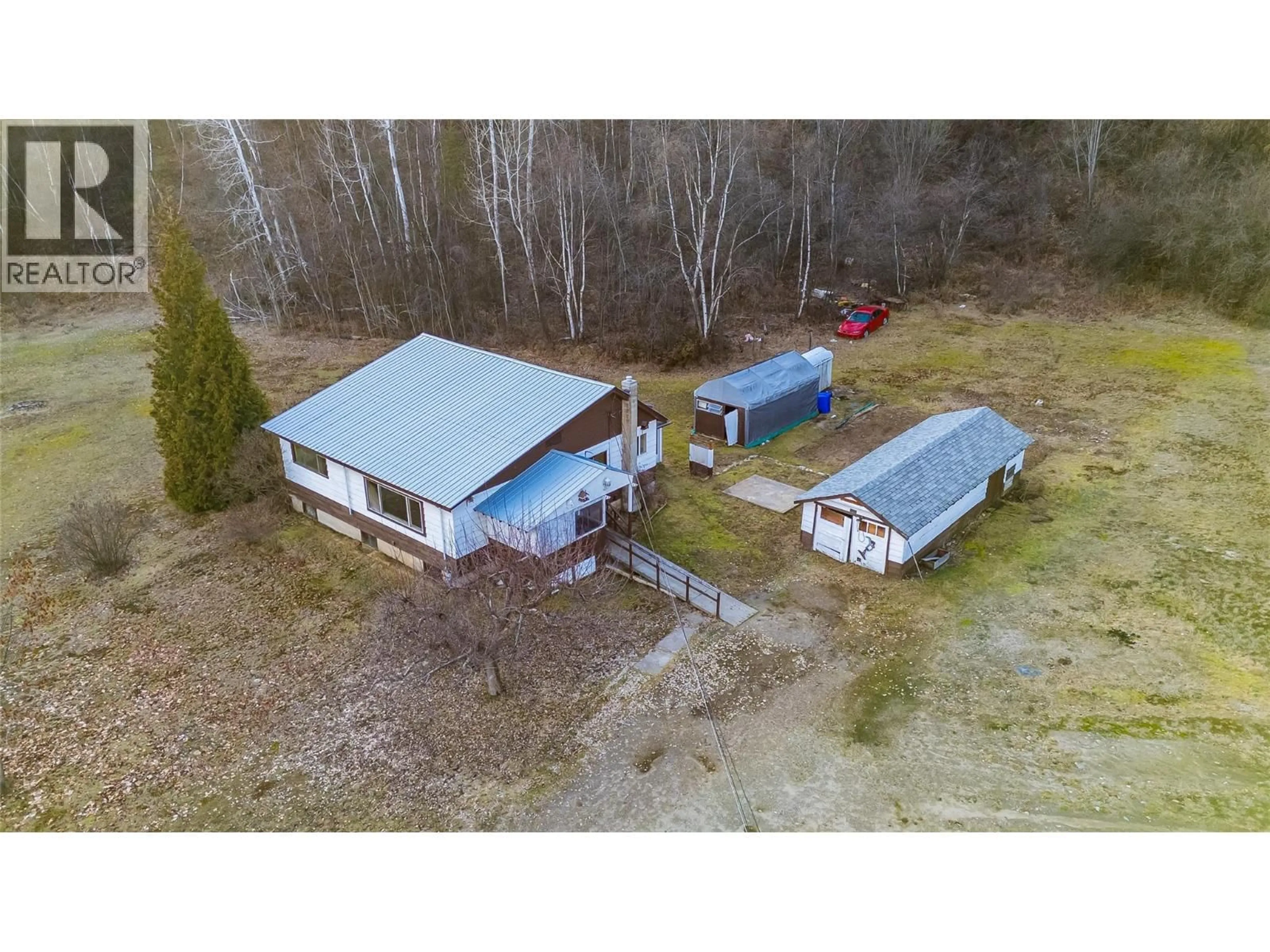 A pic from outside/outdoor area/front of a property/back of a property/a pic from drone, building for 890 CHINA CREEK ROAD, Genelle British Columbia V0G1G0