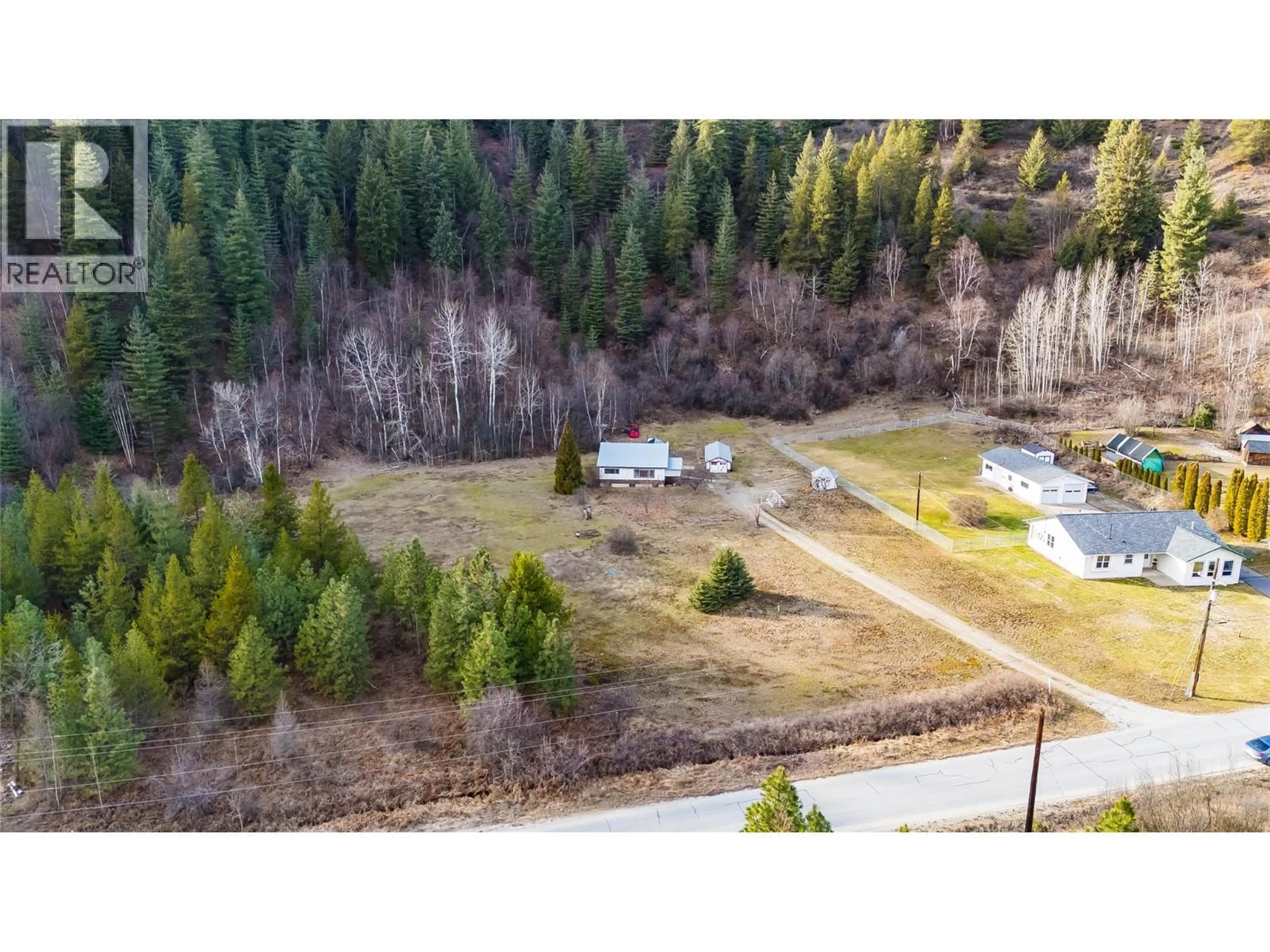 A pic from outside/outdoor area/front of a property/back of a property/a pic from drone, forest/trees view for 890 CHINA CREEK ROAD, Genelle British Columbia V0G1G0