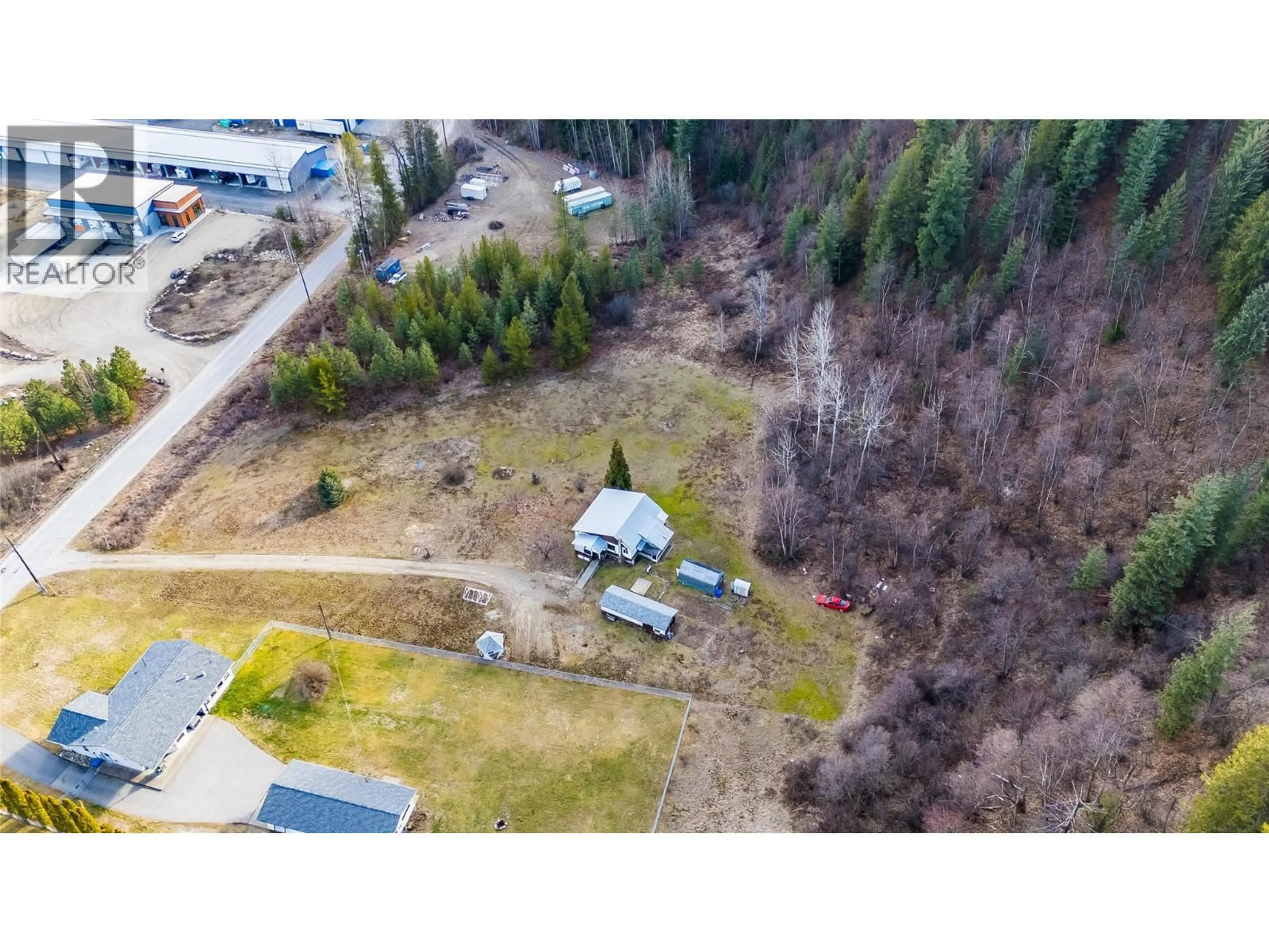 A pic from outside/outdoor area/front of a property/back of a property/a pic from drone, unknown for 890 CHINA CREEK ROAD, Genelle British Columbia V0G1G0