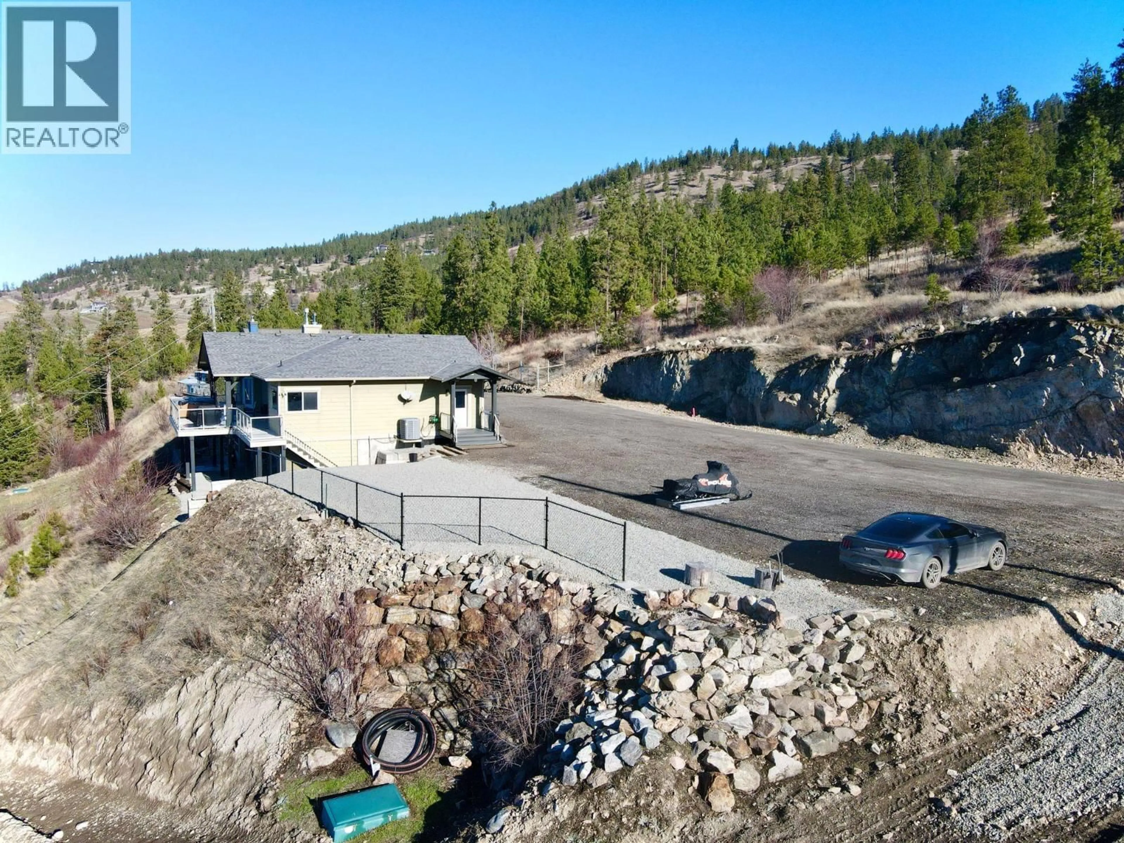 A pic from outside/outdoor area/front of a property/back of a property/a pic from drone, mountain view for 13938 MOBERLY ROAD, Lake Country British Columbia V4V1A6