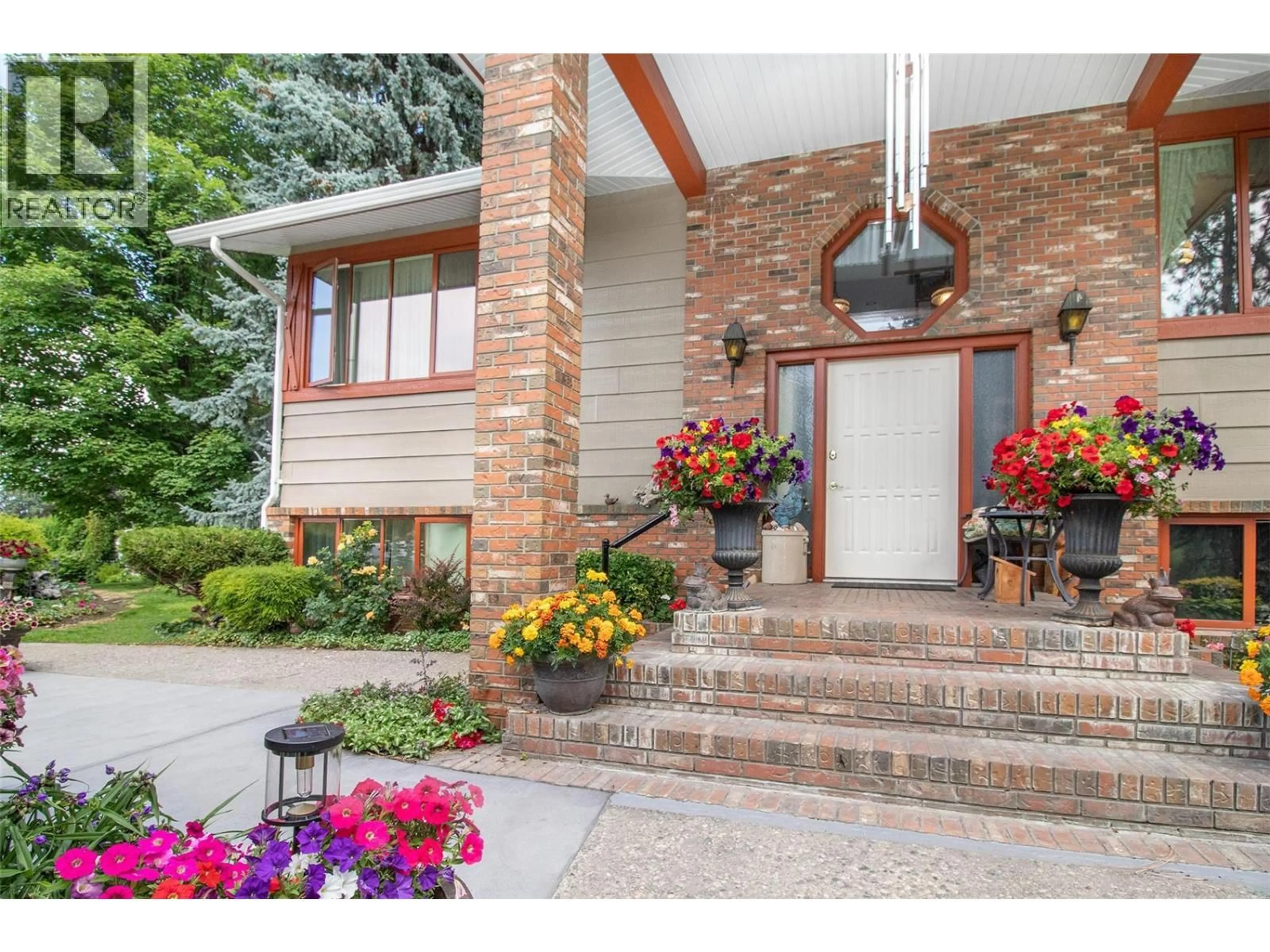 Home with brick exterior material, street for 1542 BELGO ROAD, Kelowna British Columbia V1P1C9