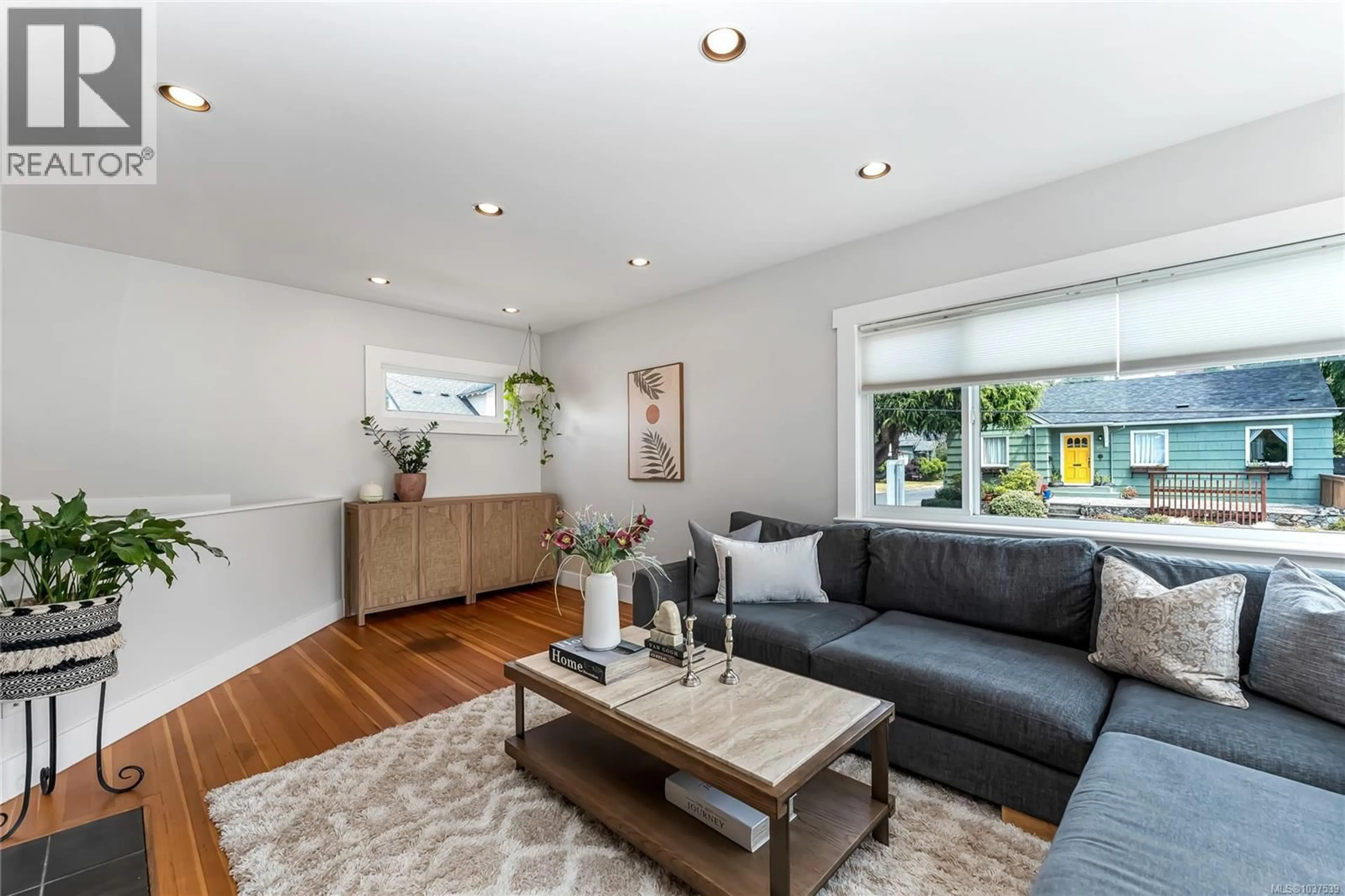 Living room with furniture, wood/laminate floor for 1779 LILLIAN ROAD, Victoria British Columbia V8S1L3