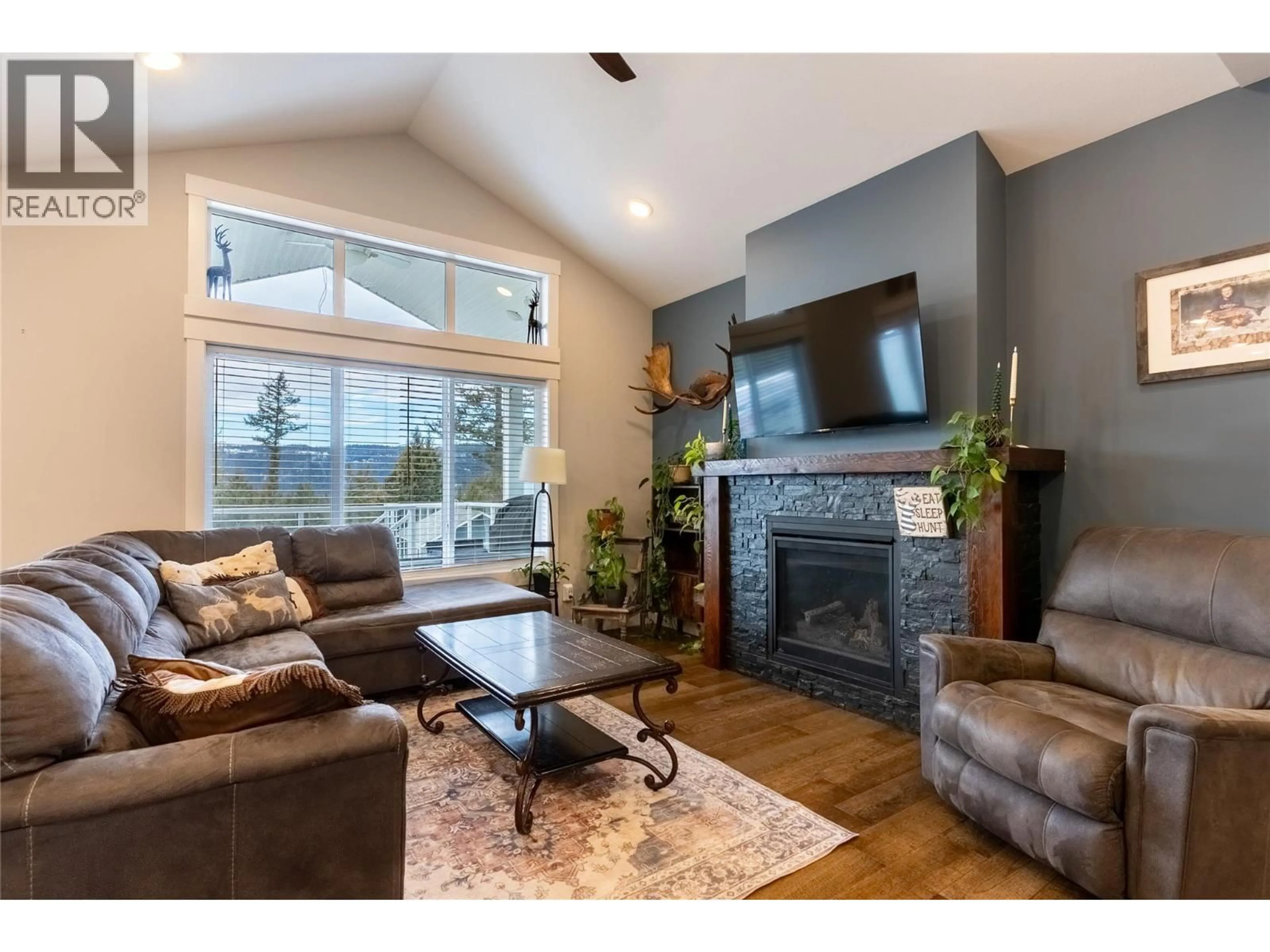 Living room with furniture, wood/laminate floor for 440 DALADON DRIVE, Logan Lake British Columbia V0K1W0