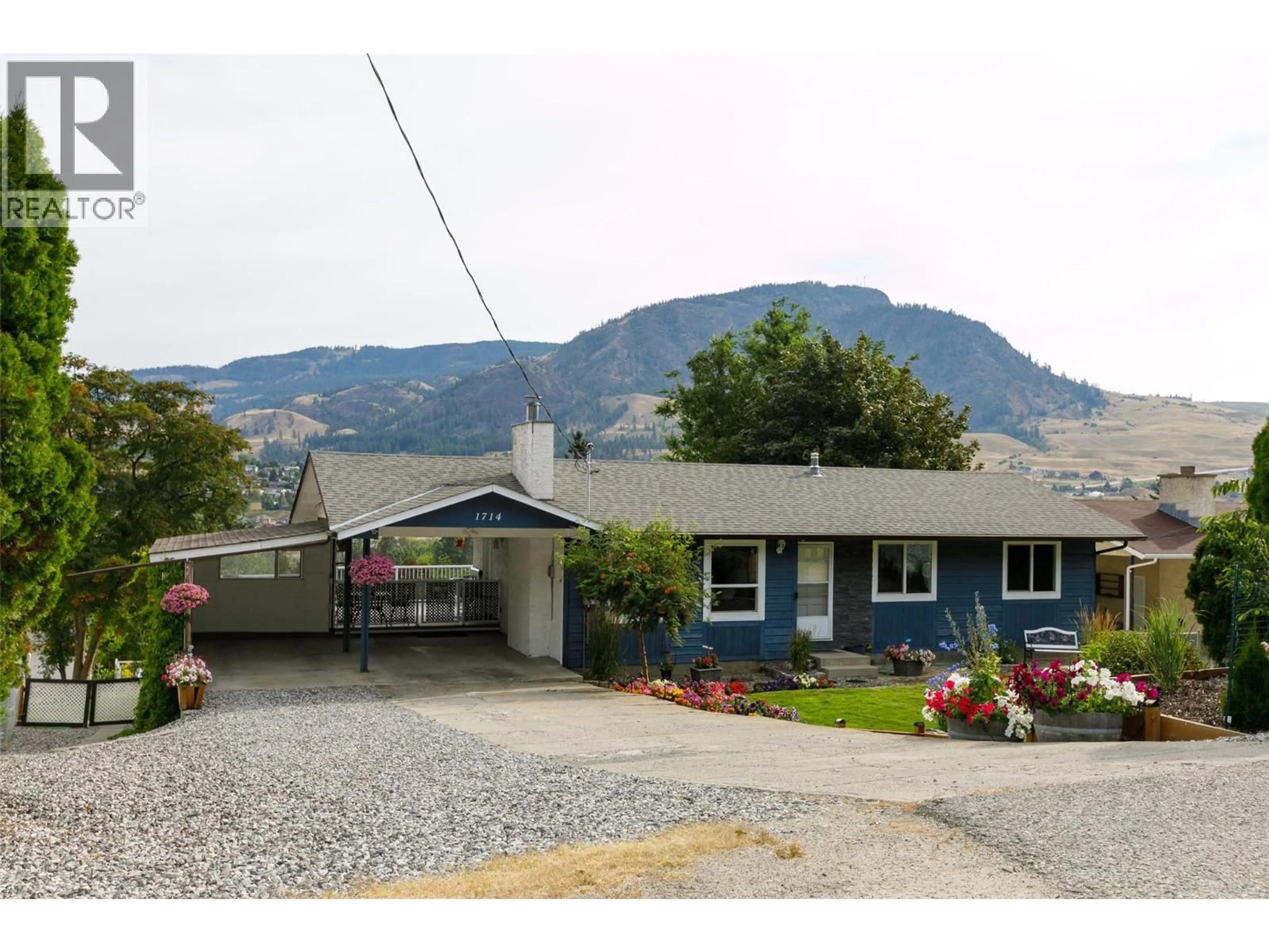 Home with vinyl exterior material, mountain view for 1714 VERDURE ROAD, Kelowna British Columbia V1P1G6