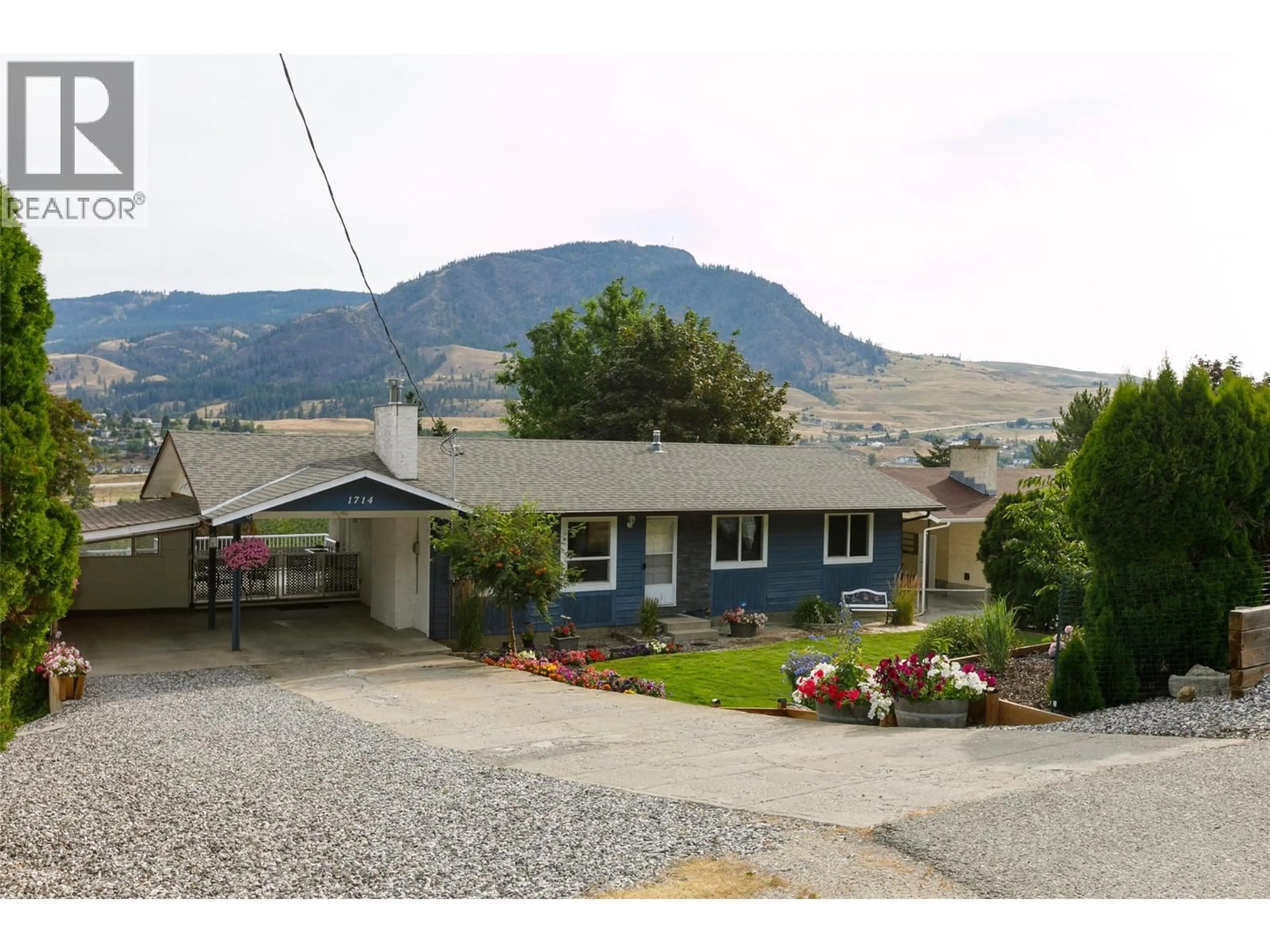 Home with vinyl exterior material, mountain view for 1714 VERDURE ROAD, Kelowna British Columbia V1P1G6