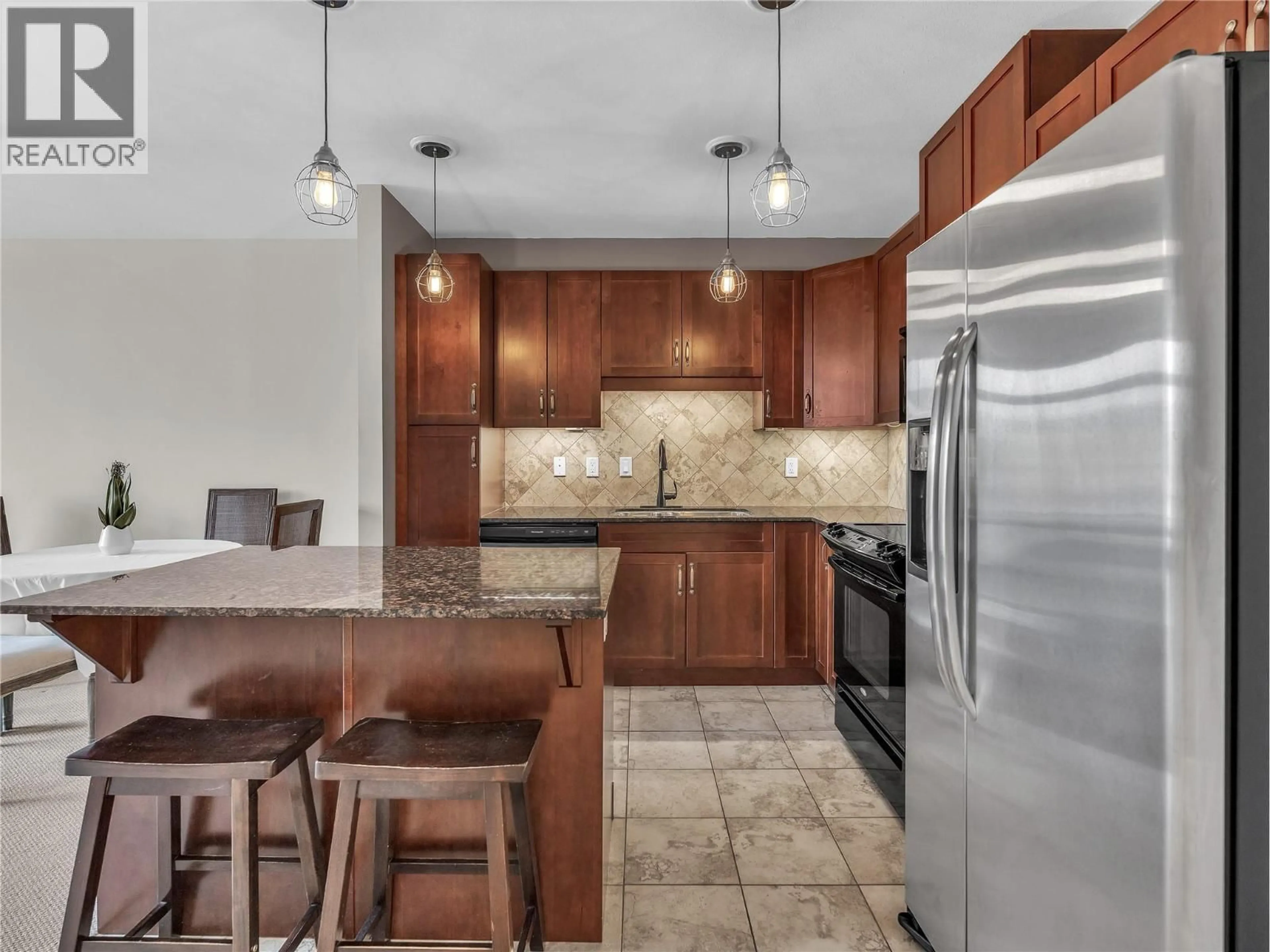 Open concept kitchen, ceramic/tile floor for 208 - 3301 SKAHA LAKE ROAD, Penticton British Columbia V2A6G6