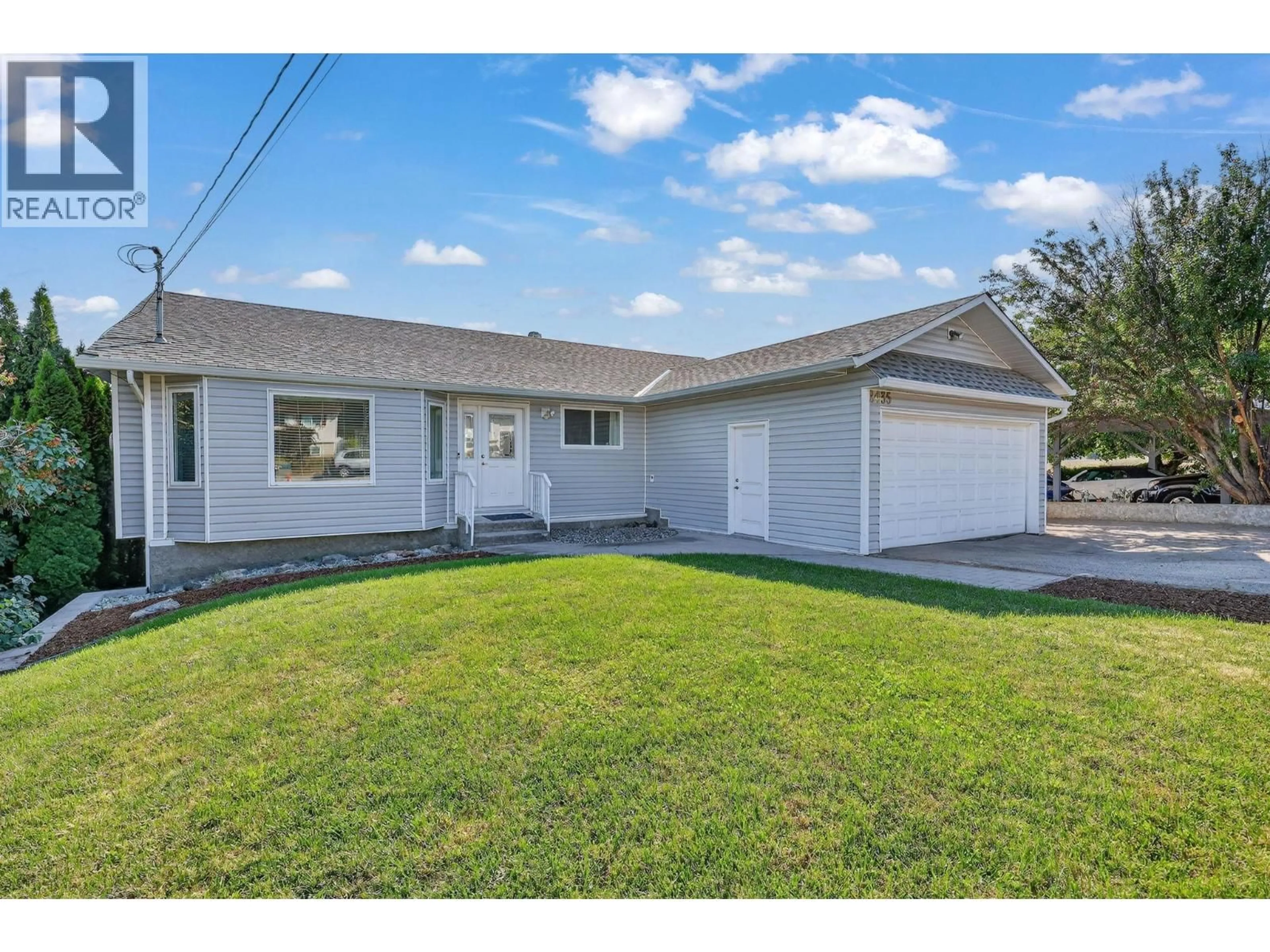 Home with vinyl exterior material, street for 2435 BUTT ROAD, West Kelowna British Columbia V4T1N7