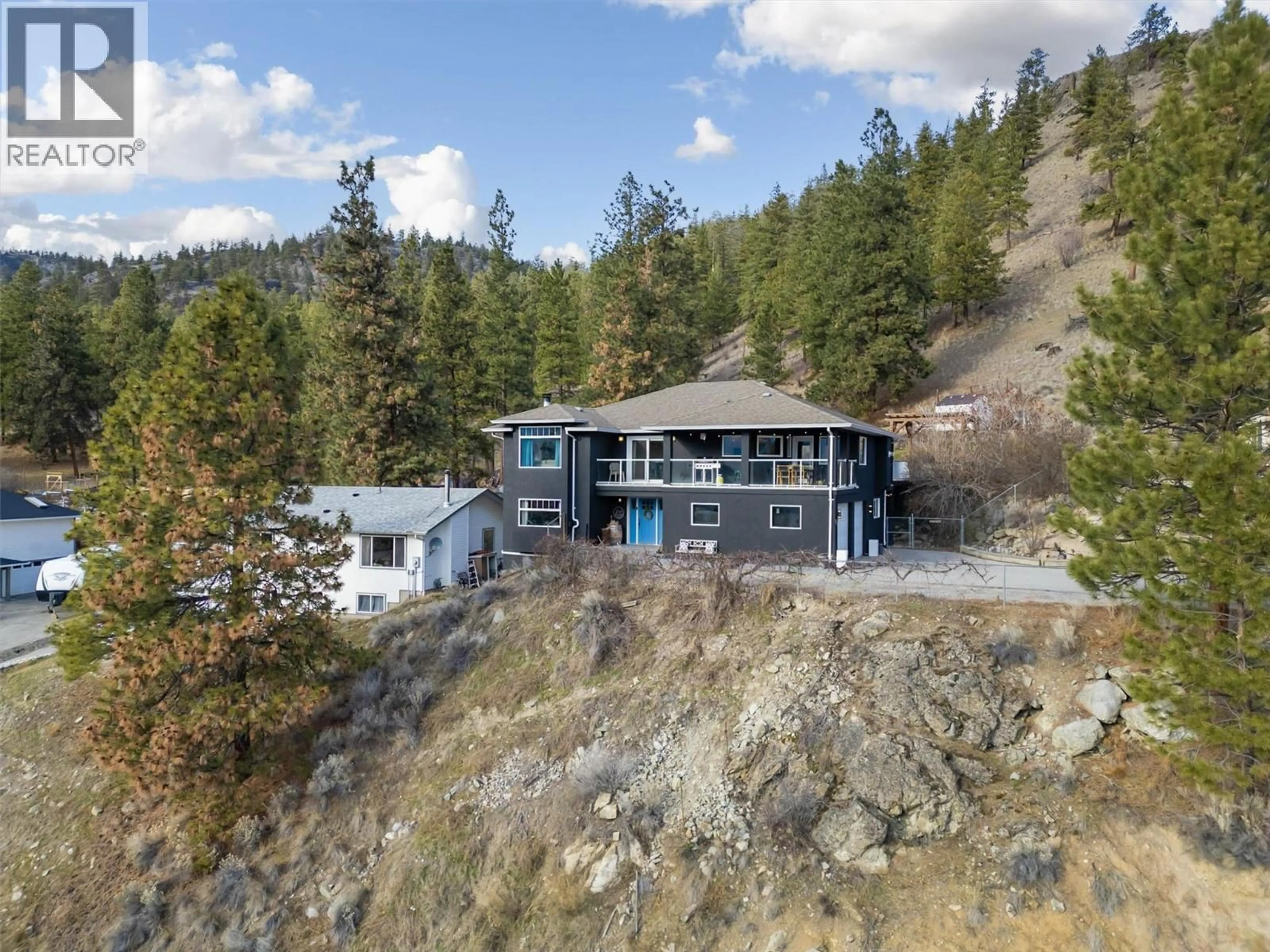 A pic from outside/outdoor area/front of a property/back of a property/a pic from drone, mountain view for 13411 HERMISTON DRIVE, Summerland British Columbia V0H1Z8