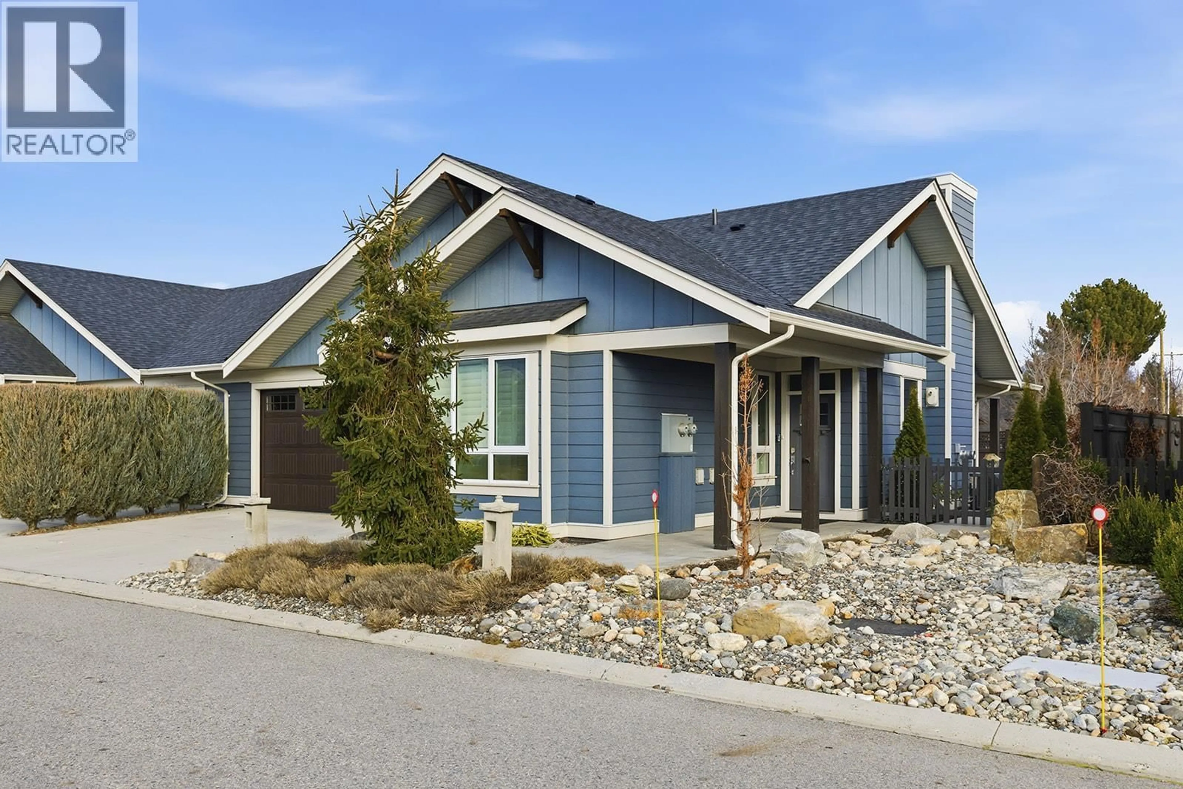 Home with vinyl exterior material, street for 52 - 1960 KLO ROAD, Kelowna British Columbia V1W5L2