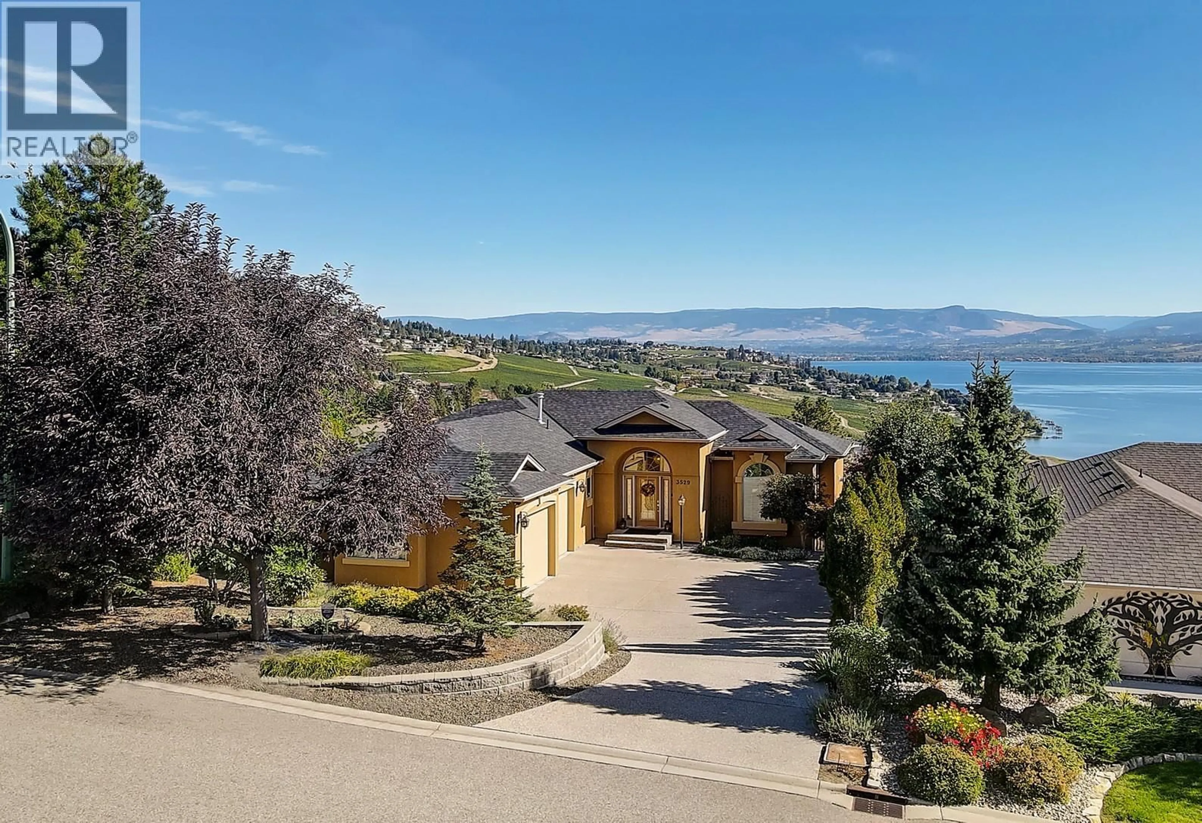 A pic from outside/outdoor area/front of a property/back of a property/a pic from drone, mountain view for 3529 GALA VIEW DRIVE, West Kelowna British Columbia V4T2M3