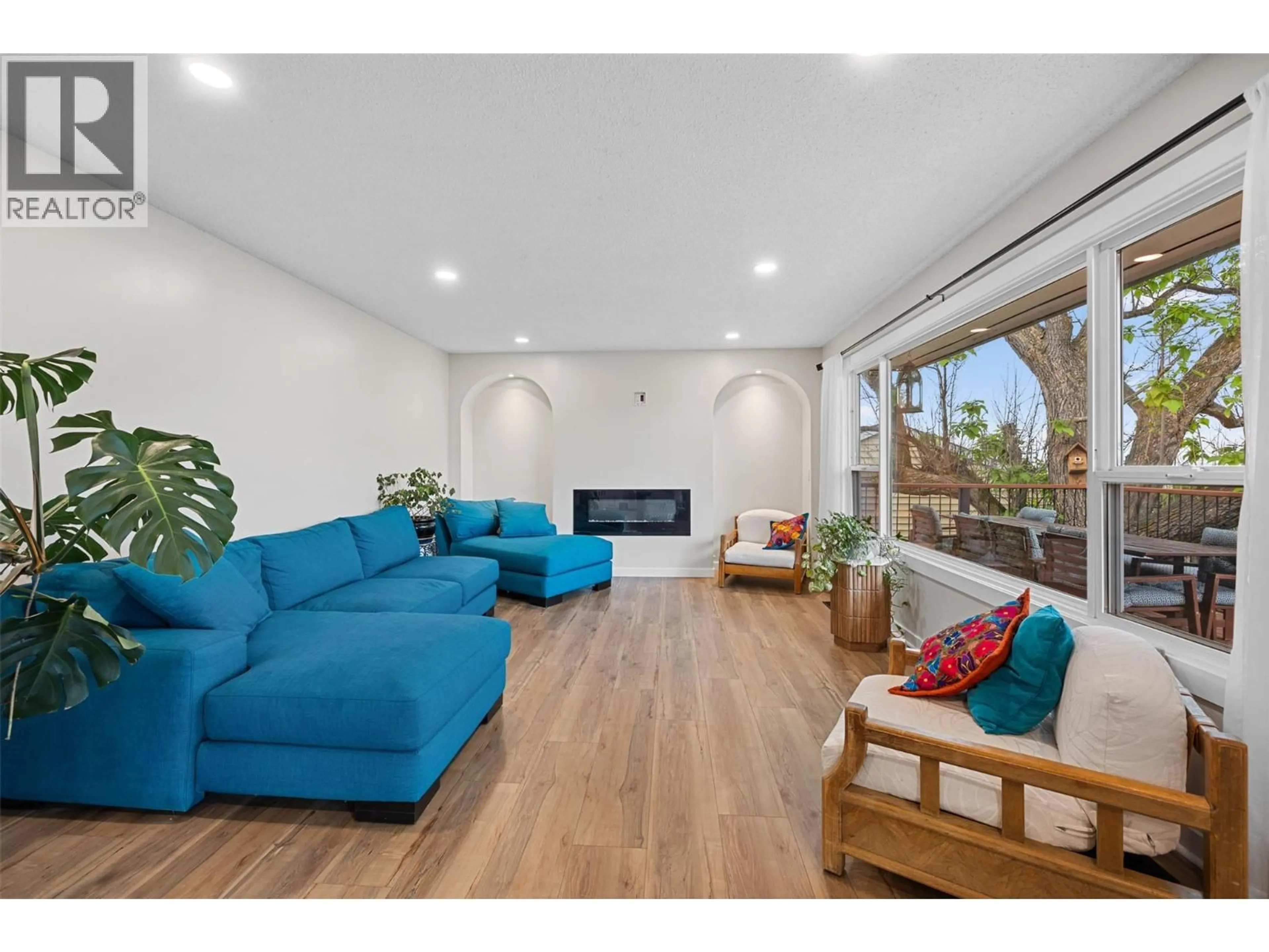 Living room with furniture, wood/laminate floor for 3754 CARRALL ROAD, West Kelowna British Columbia V4t2C6