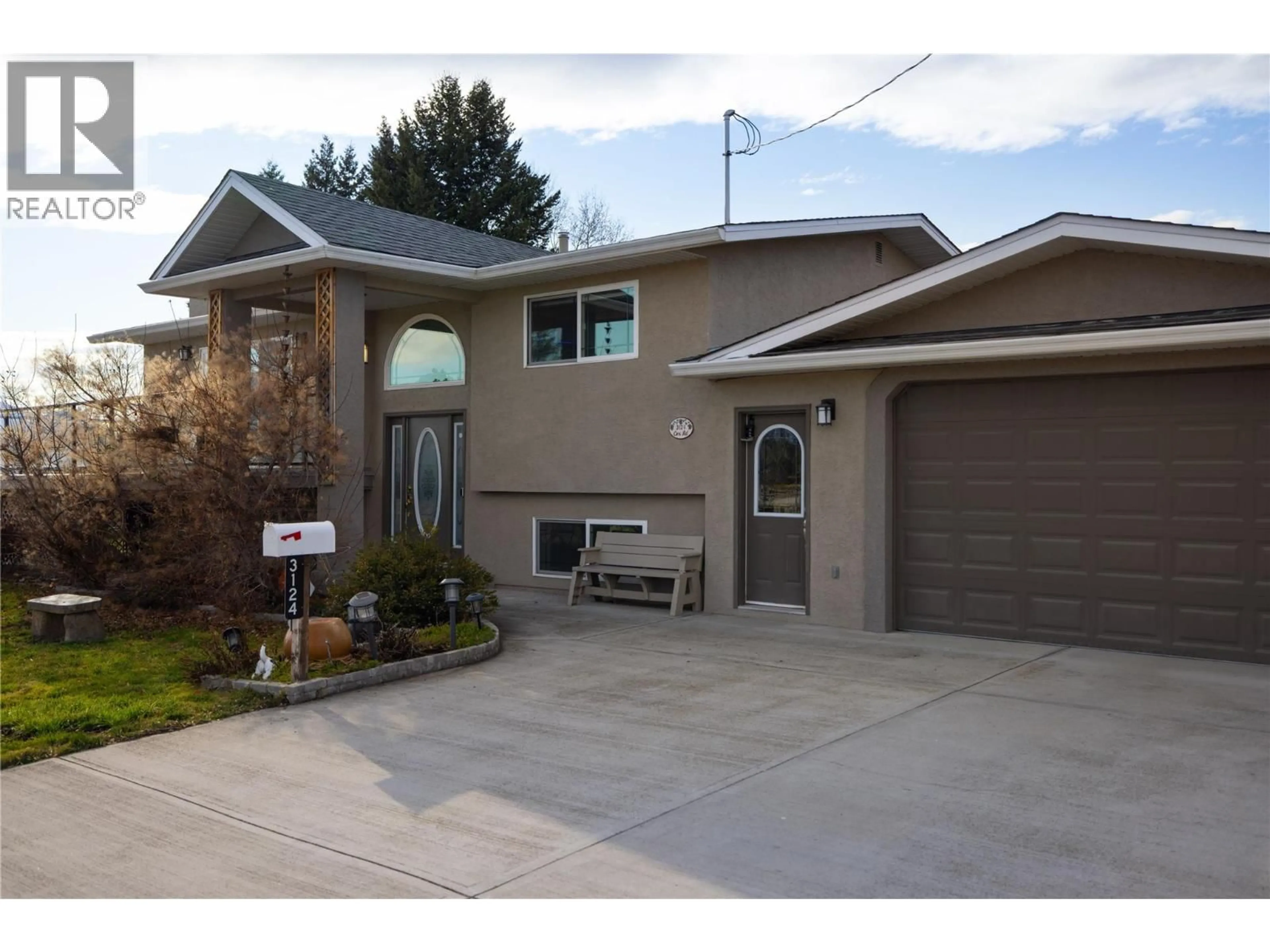 Home with vinyl exterior material, street for 3124 COX ROAD, West Kelowna British Columbia V1Z2B4