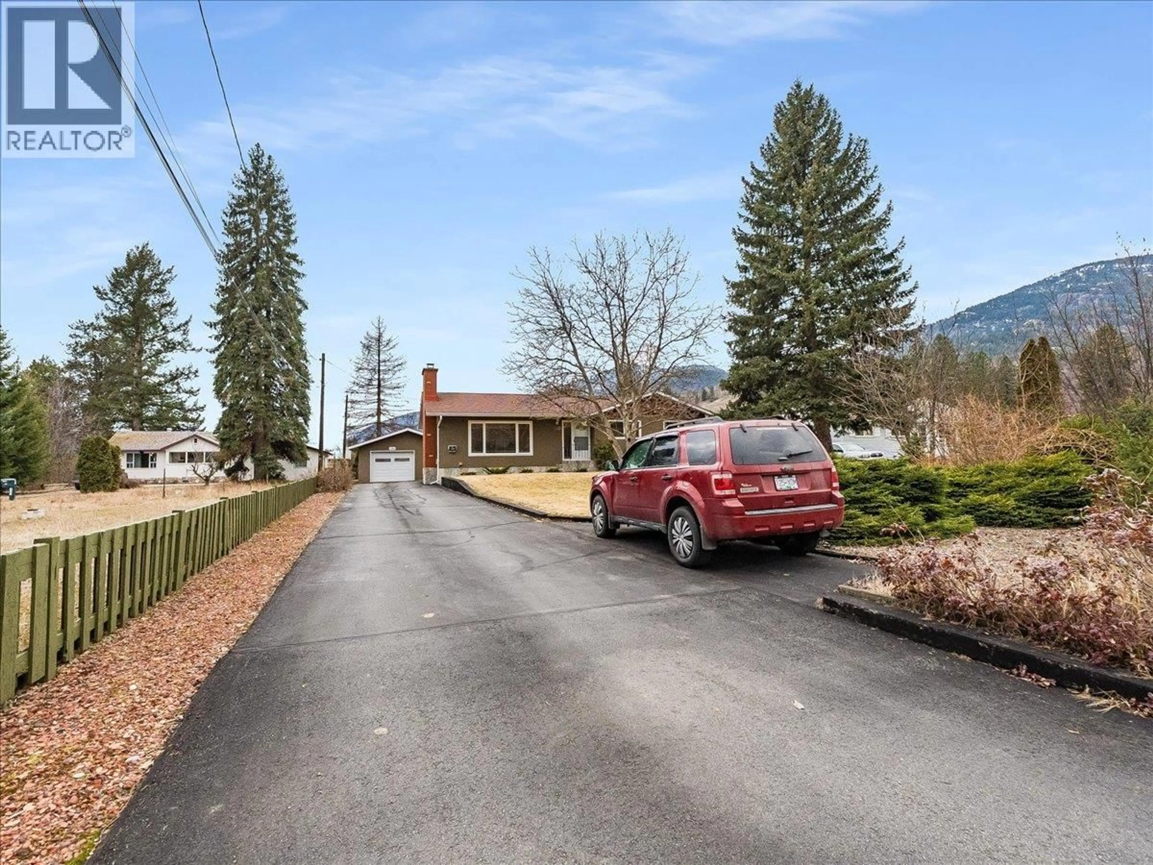 A pic from outside/outdoor area/front of a property/back of a property/a pic from drone, mountain view for 130 100TH STREET, Castlegar British Columbia V1N3C5
