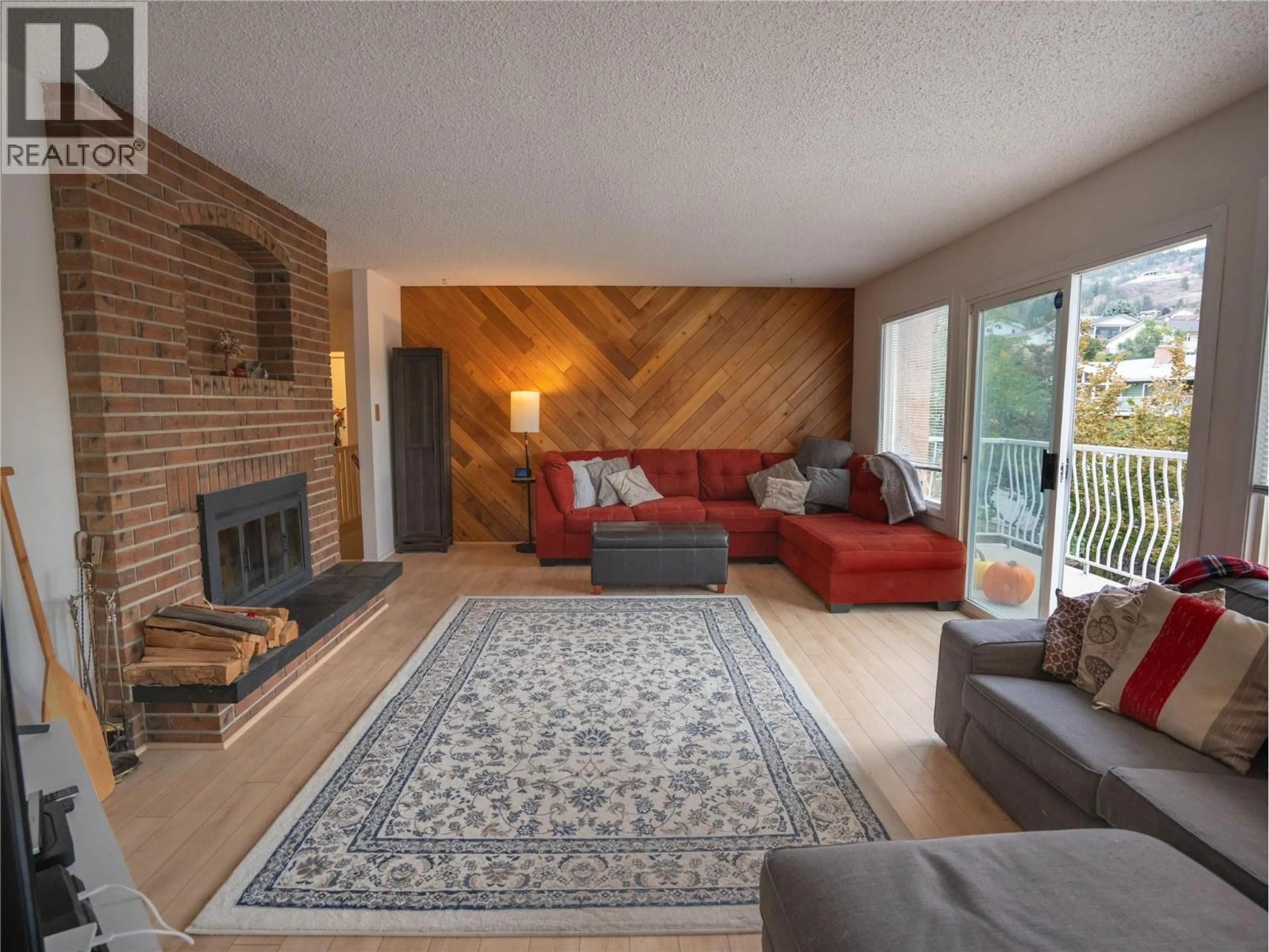 Living room with furniture, wood/laminate floor for 190 DAFOE PLACE, Penticton British Columbia V2A7E6