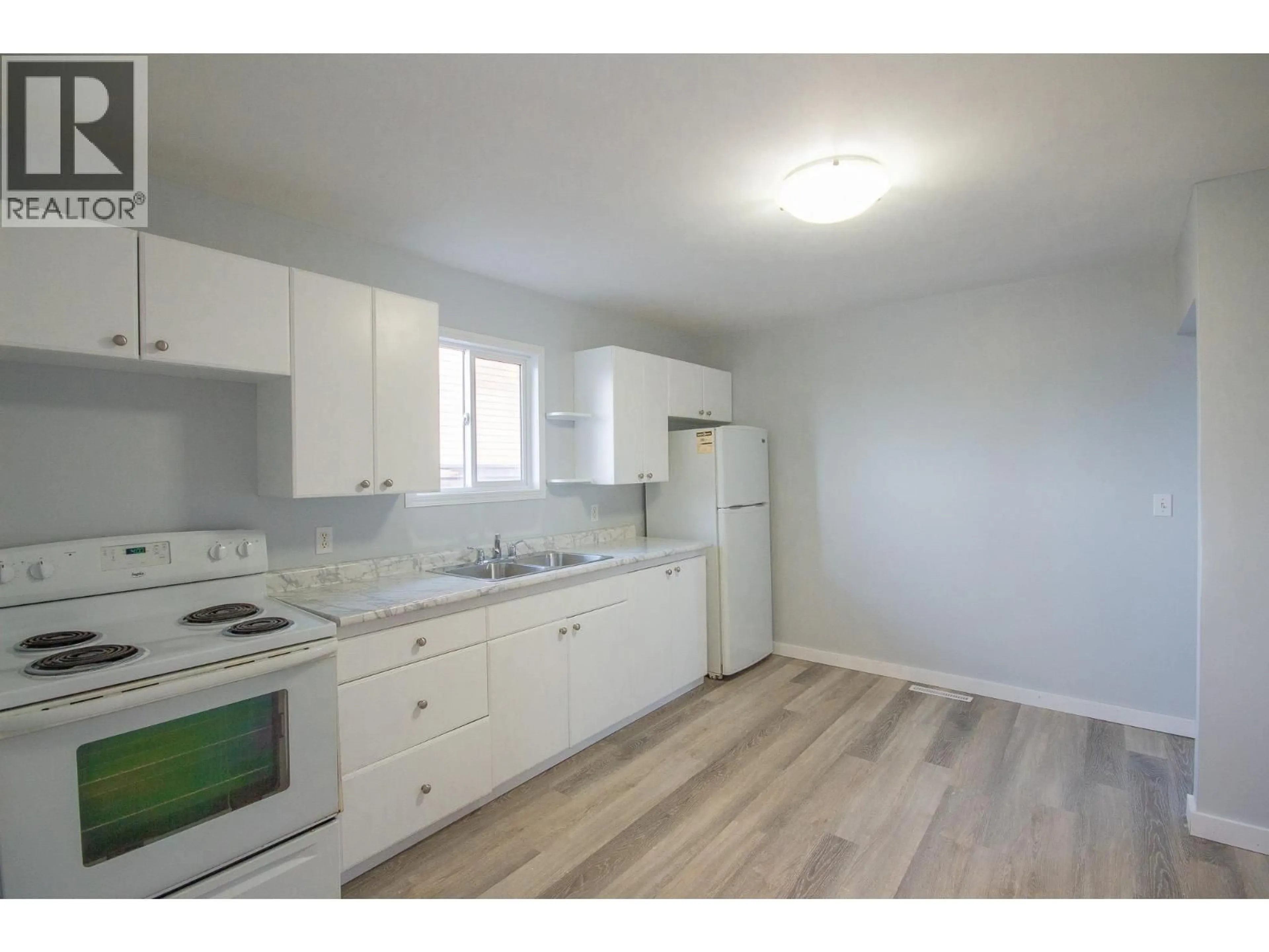 Standard kitchen, wood/laminate floor for 9705 8 STREET, Dawson Creek British Columbia V1G3P5