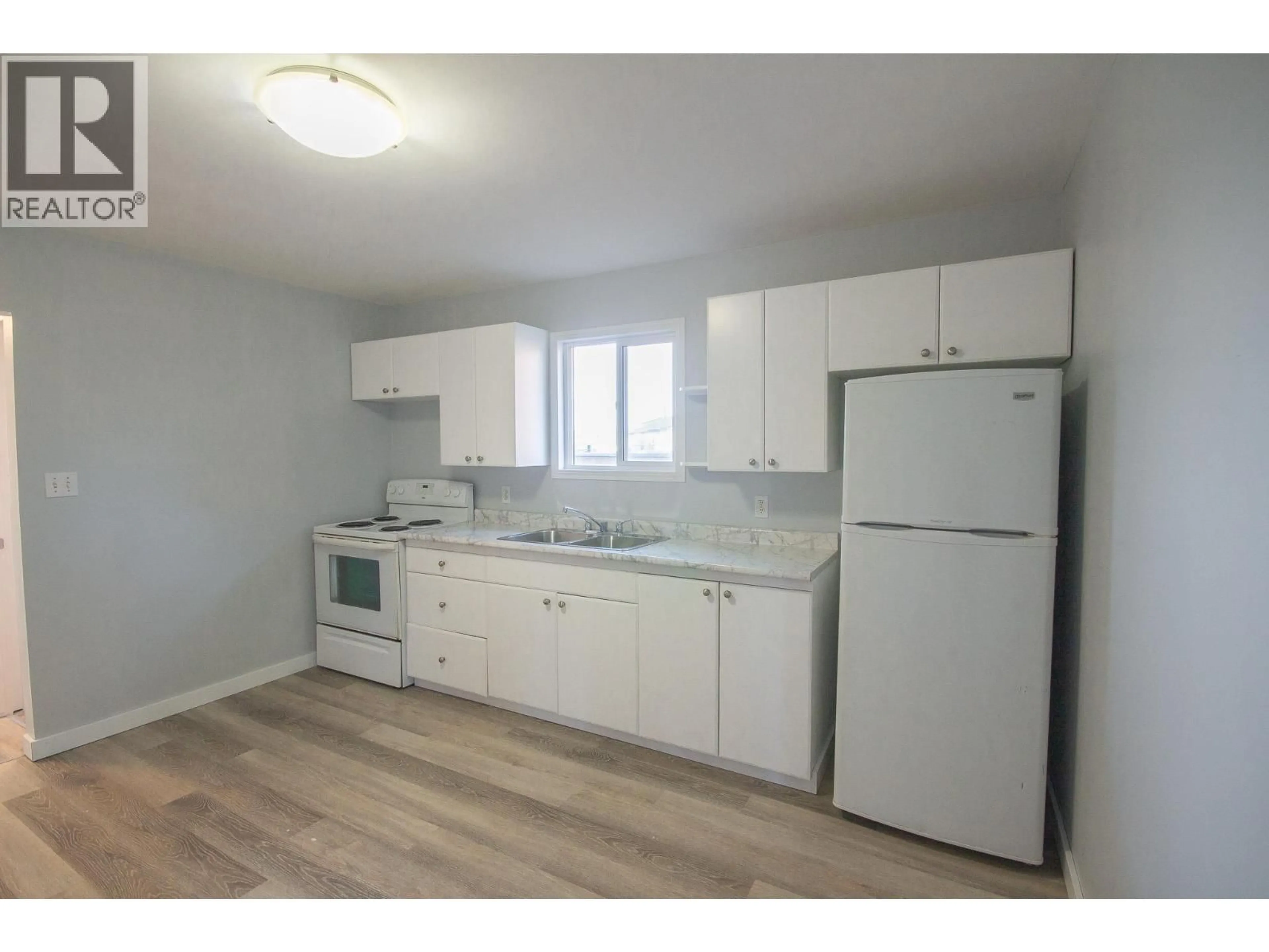 Standard kitchen, wood/laminate floor for 9705 8 STREET, Dawson Creek British Columbia V1G3P5