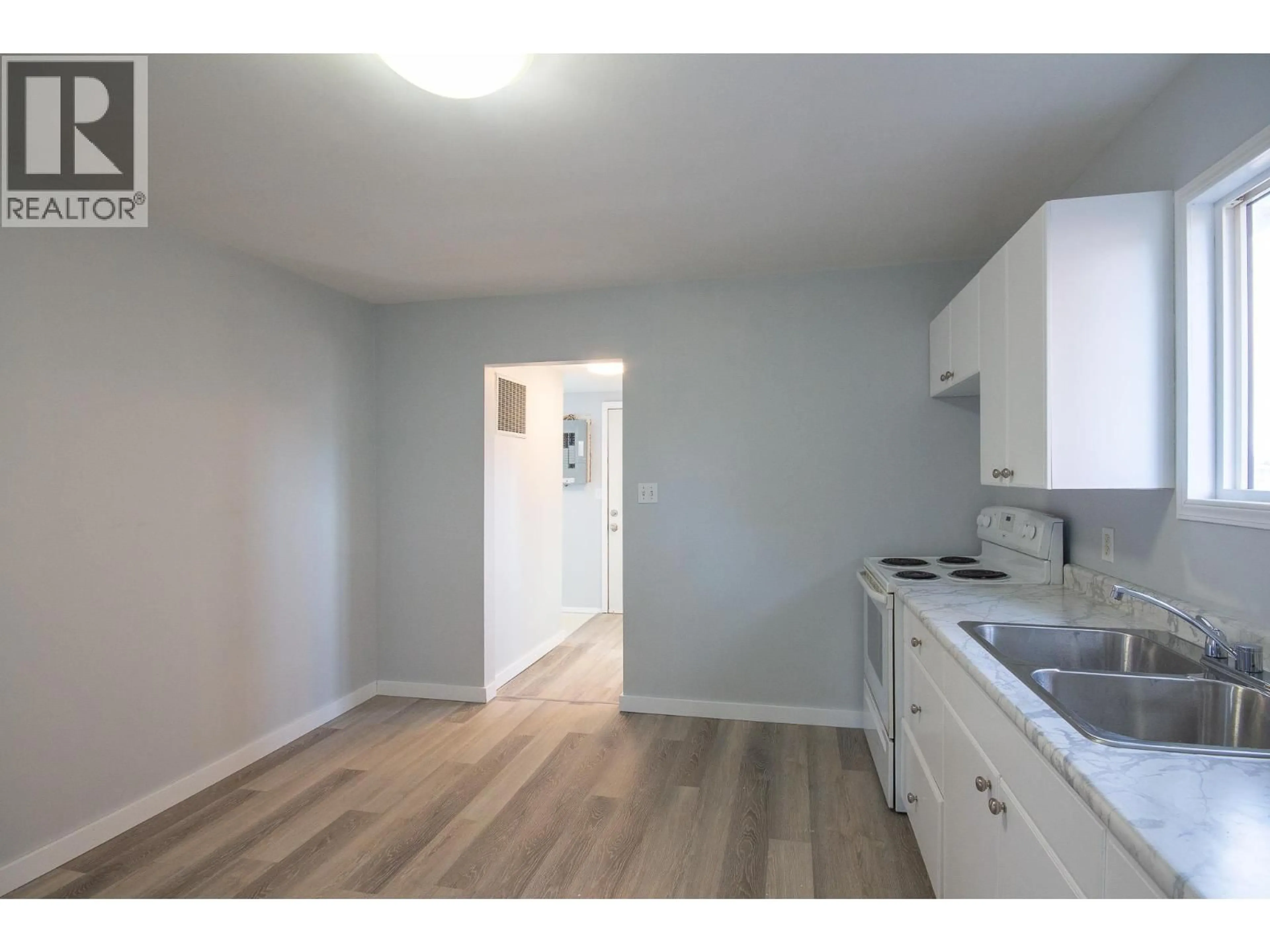 Standard kitchen, wood/laminate floor for 9705 8 STREET, Dawson Creek British Columbia V1G3P5