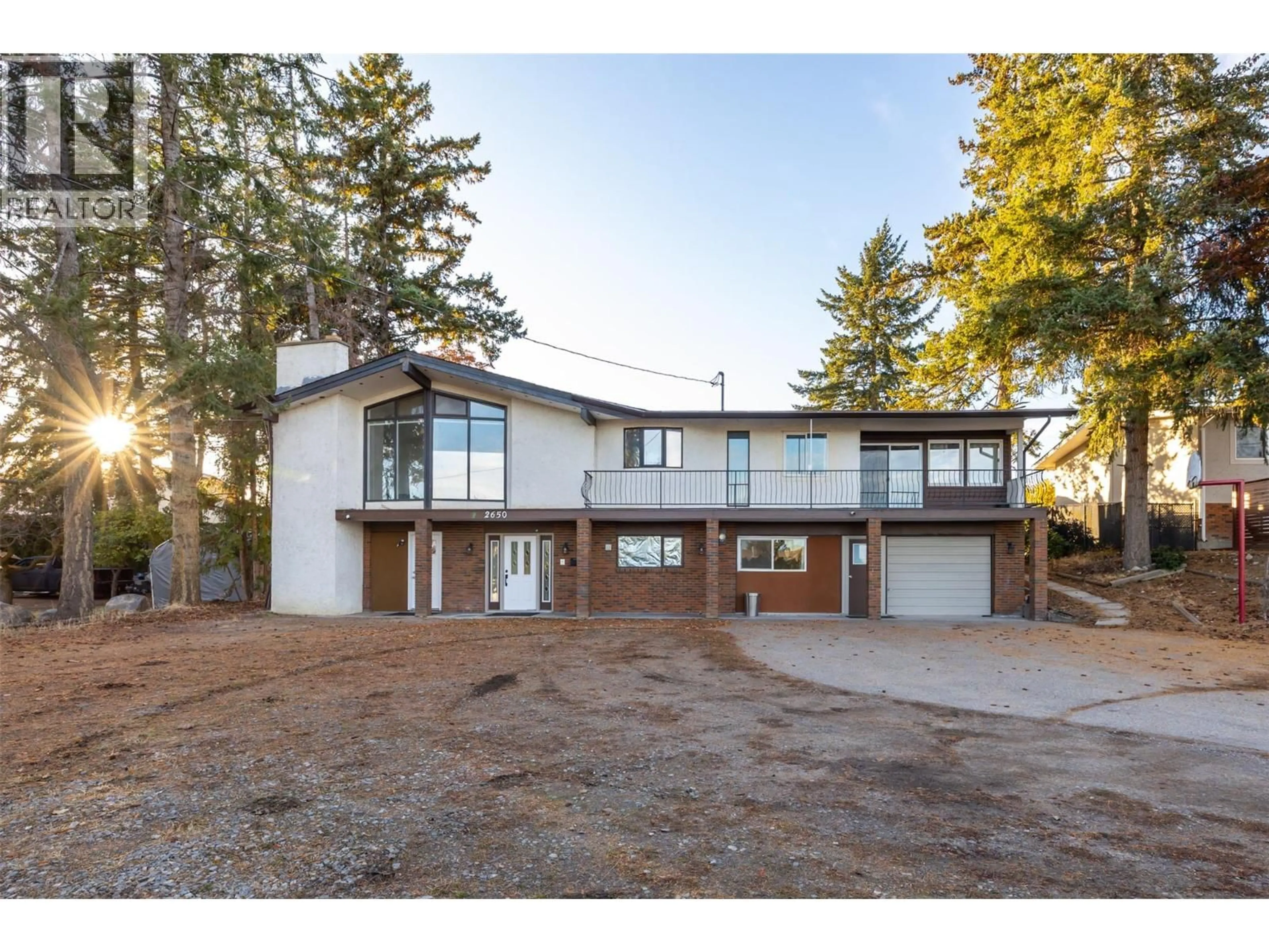 A pic from outside/outdoor area/front of a property/back of a property/a pic from drone, unknown for 2650 THACKER DRIVE, West Kelowna British Columbia V1Z1W3