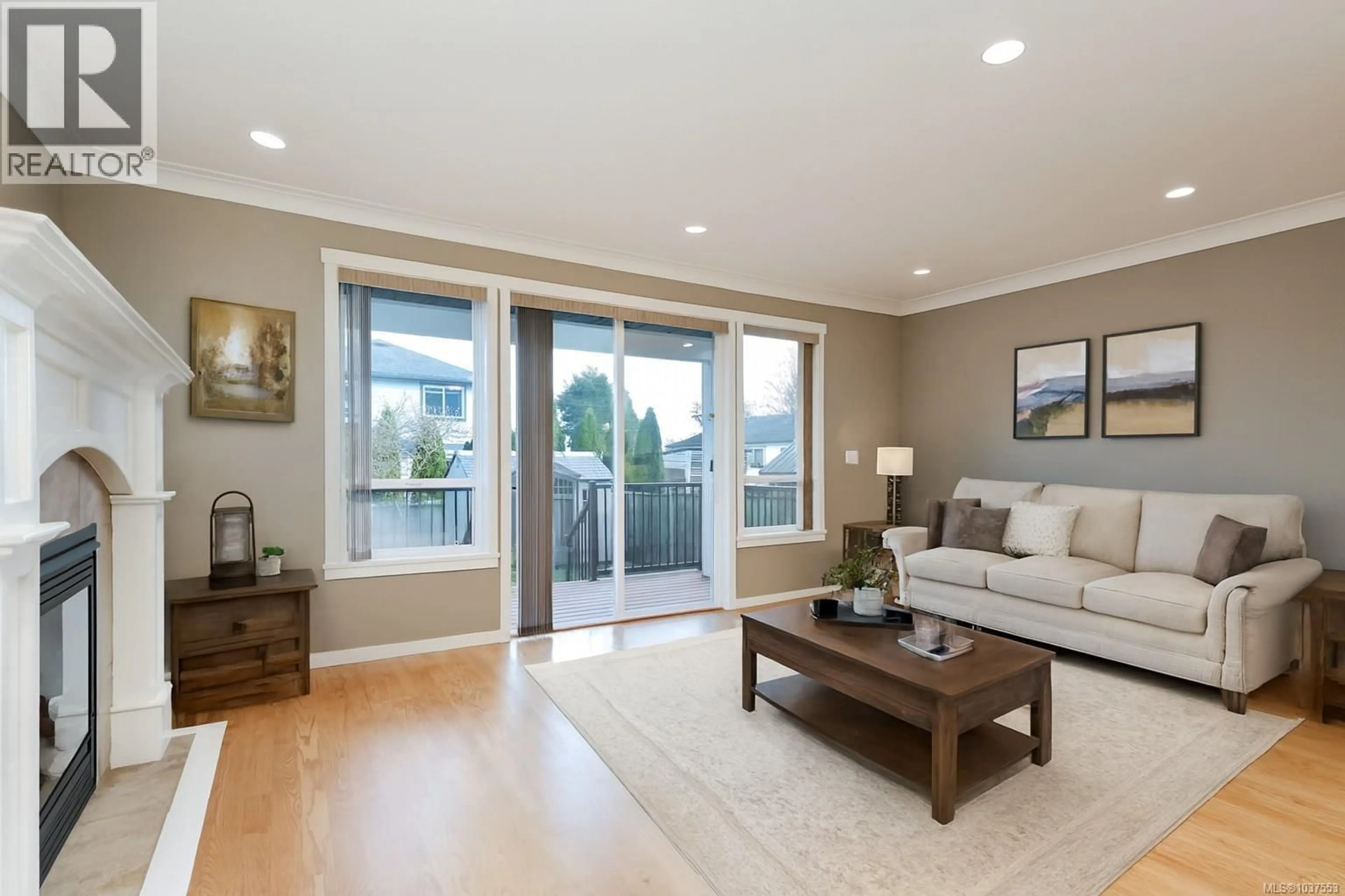 Living room with furniture, wood/laminate floor for 2075 DOVER STREET, Sooke British Columbia V9Z1L1