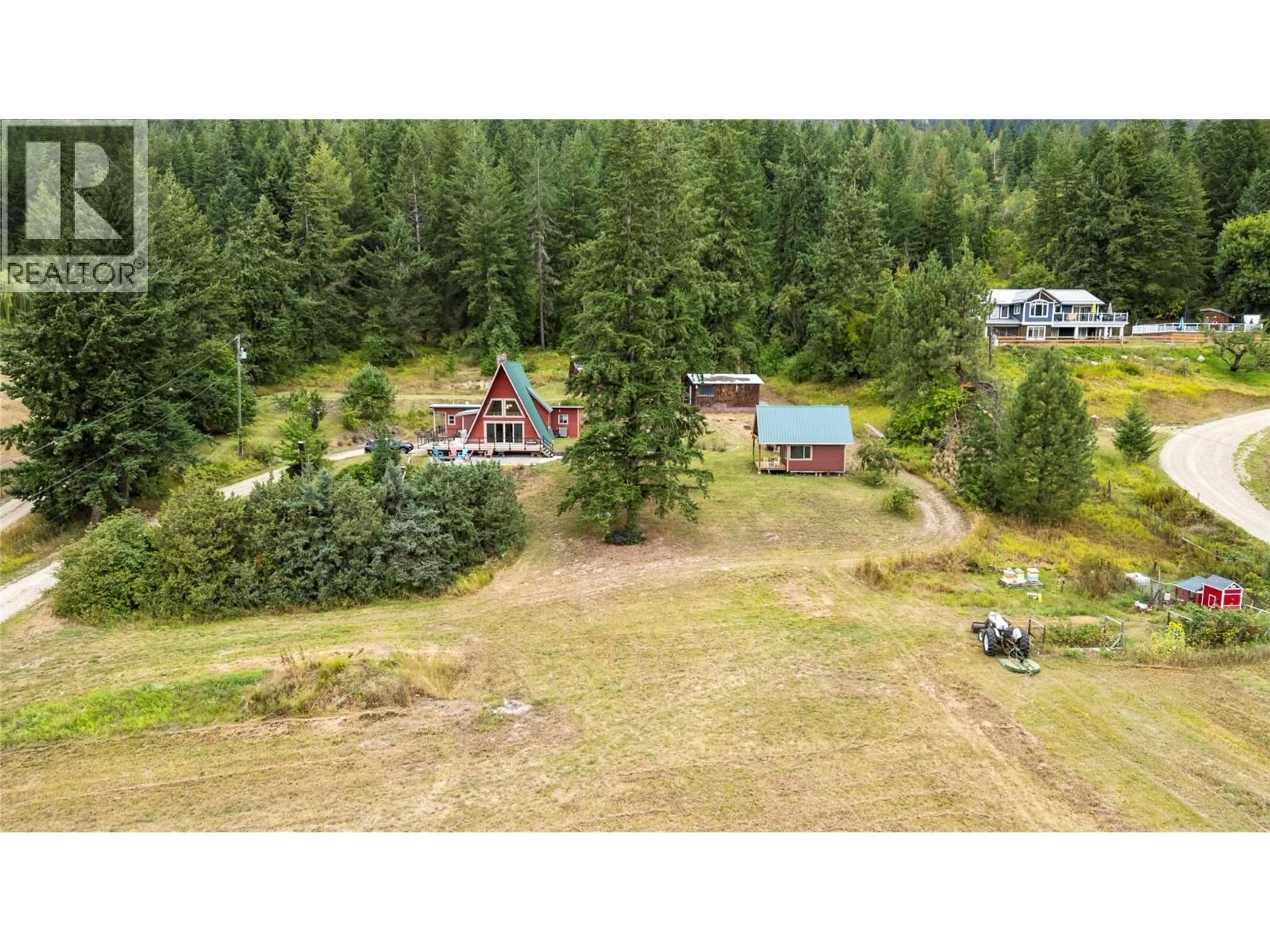 A pic from outside/outdoor area/front of a property/back of a property/a pic from drone, forest/trees view for 6551 40 STREET NORTHWEST, Salmon Arm British Columbia V1E3A5