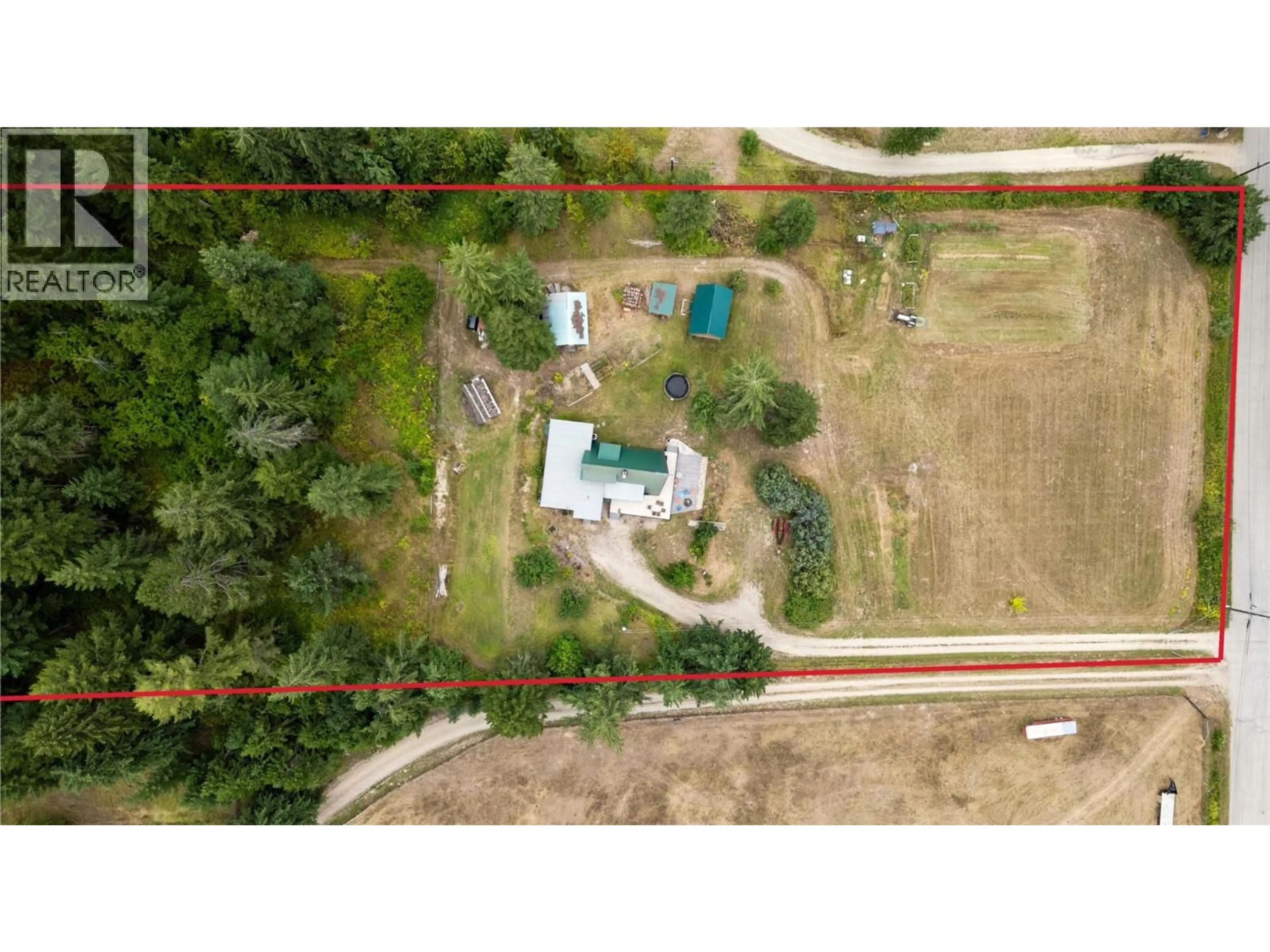 A pic from outside/outdoor area/front of a property/back of a property/a pic from drone, forest/trees view for 6551 40 STREET NORTHWEST, Salmon Arm British Columbia V1E3A5