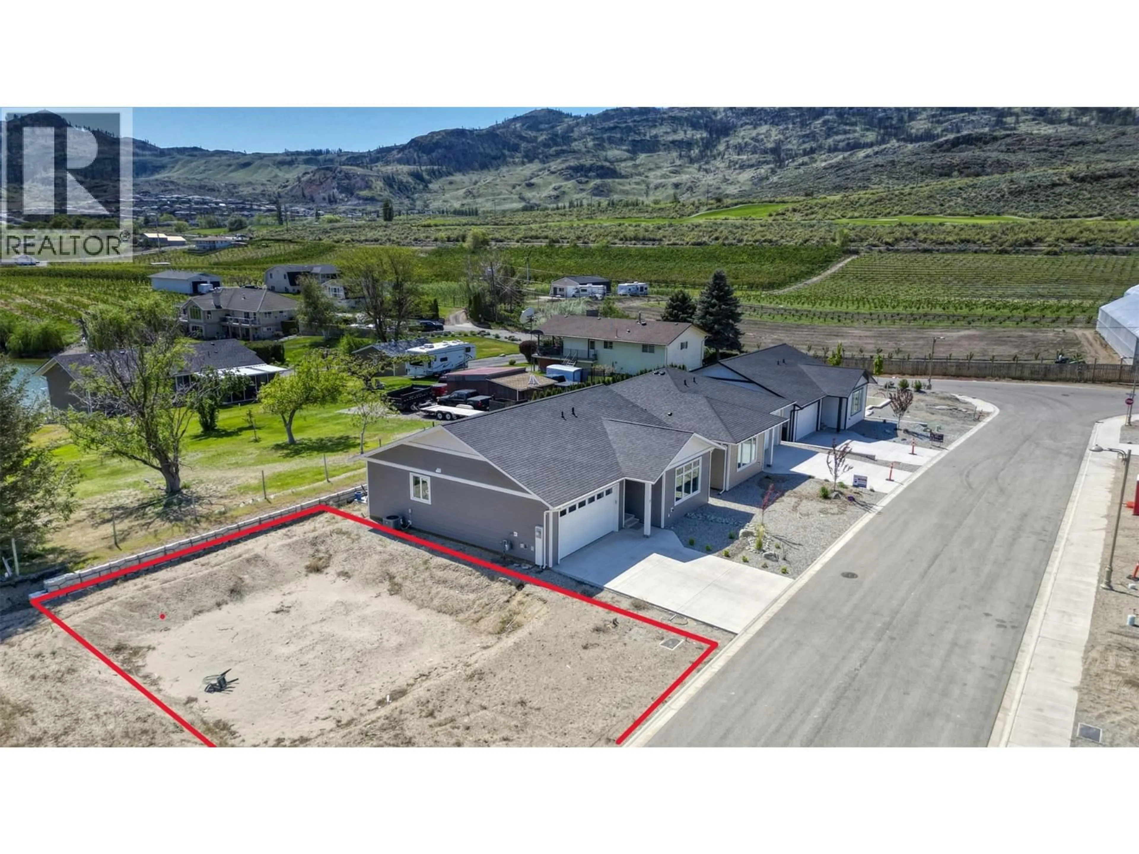 A pic from outside/outdoor area/front of a property/back of a property/a pic from drone, mountain view for 13 WOOD DUCK WAY, Osoyoos British Columbia V0H1V5