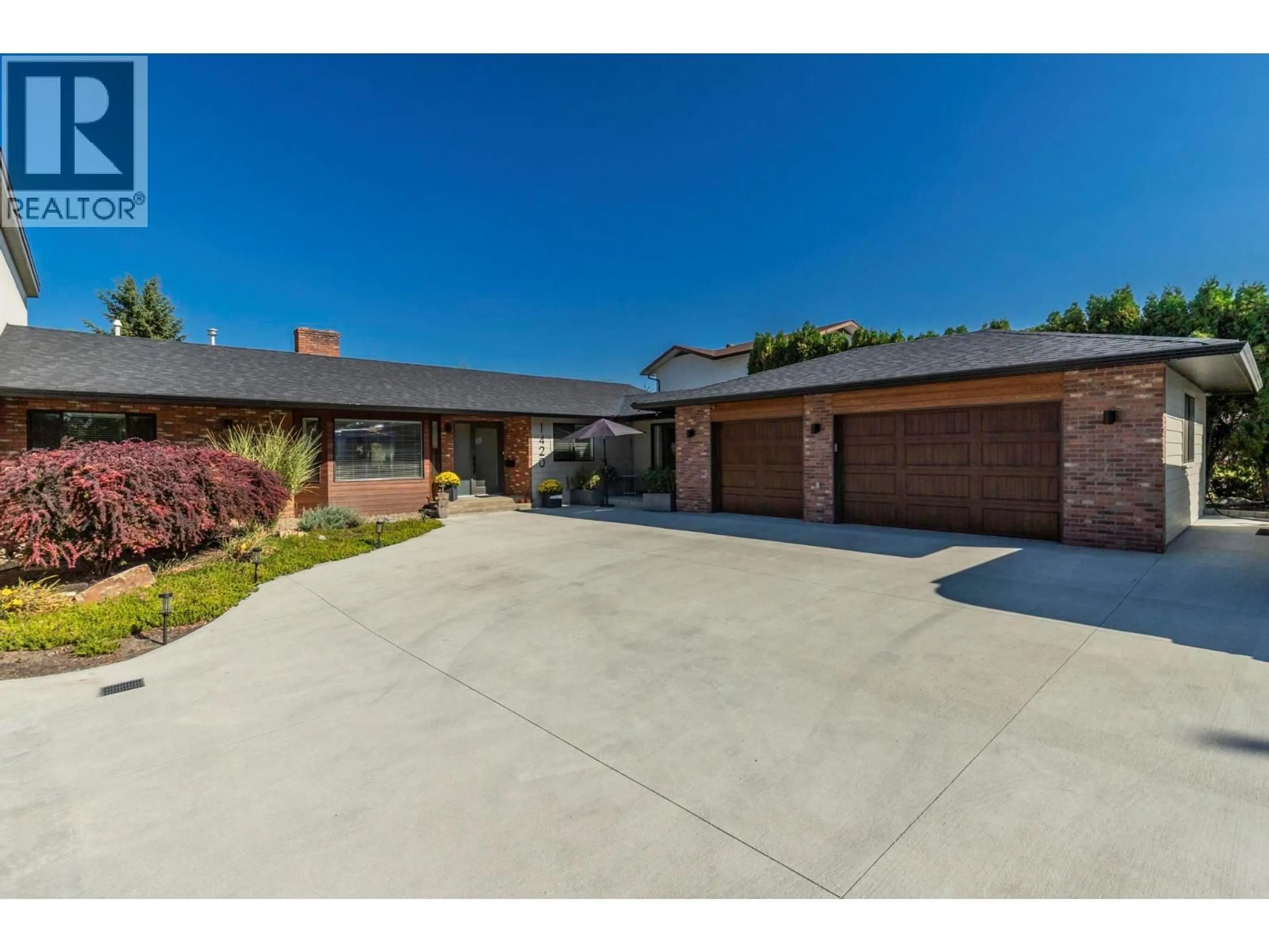 Home with brick exterior material, street for 1420 INKAR ROAD, Kelowna British Columbia V1Y8H7