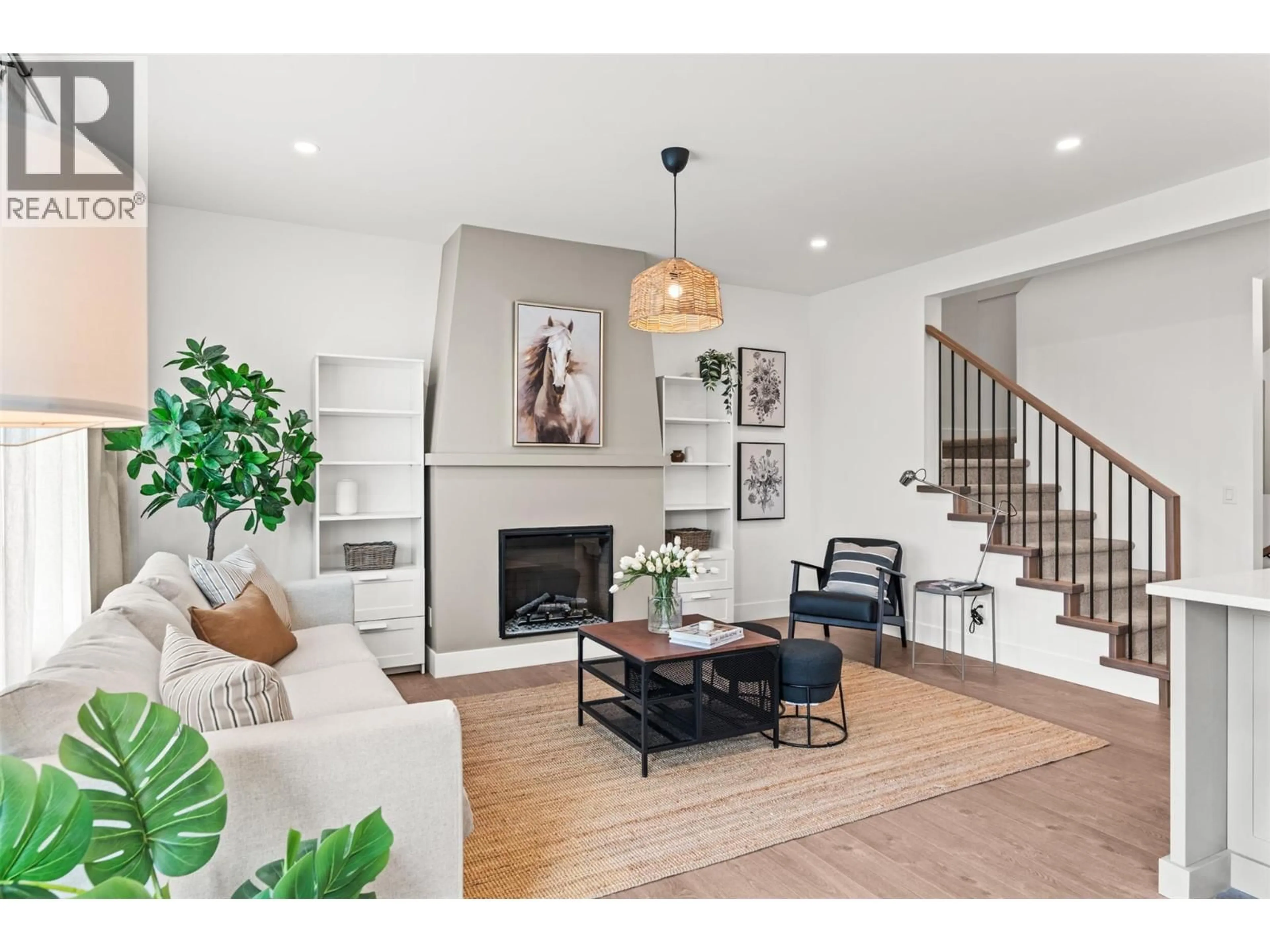 Living room with furniture, wood/laminate floor for 102 - 2455 BRADLEY DRIVE, Armstrong British Columbia V4Y0Y4
