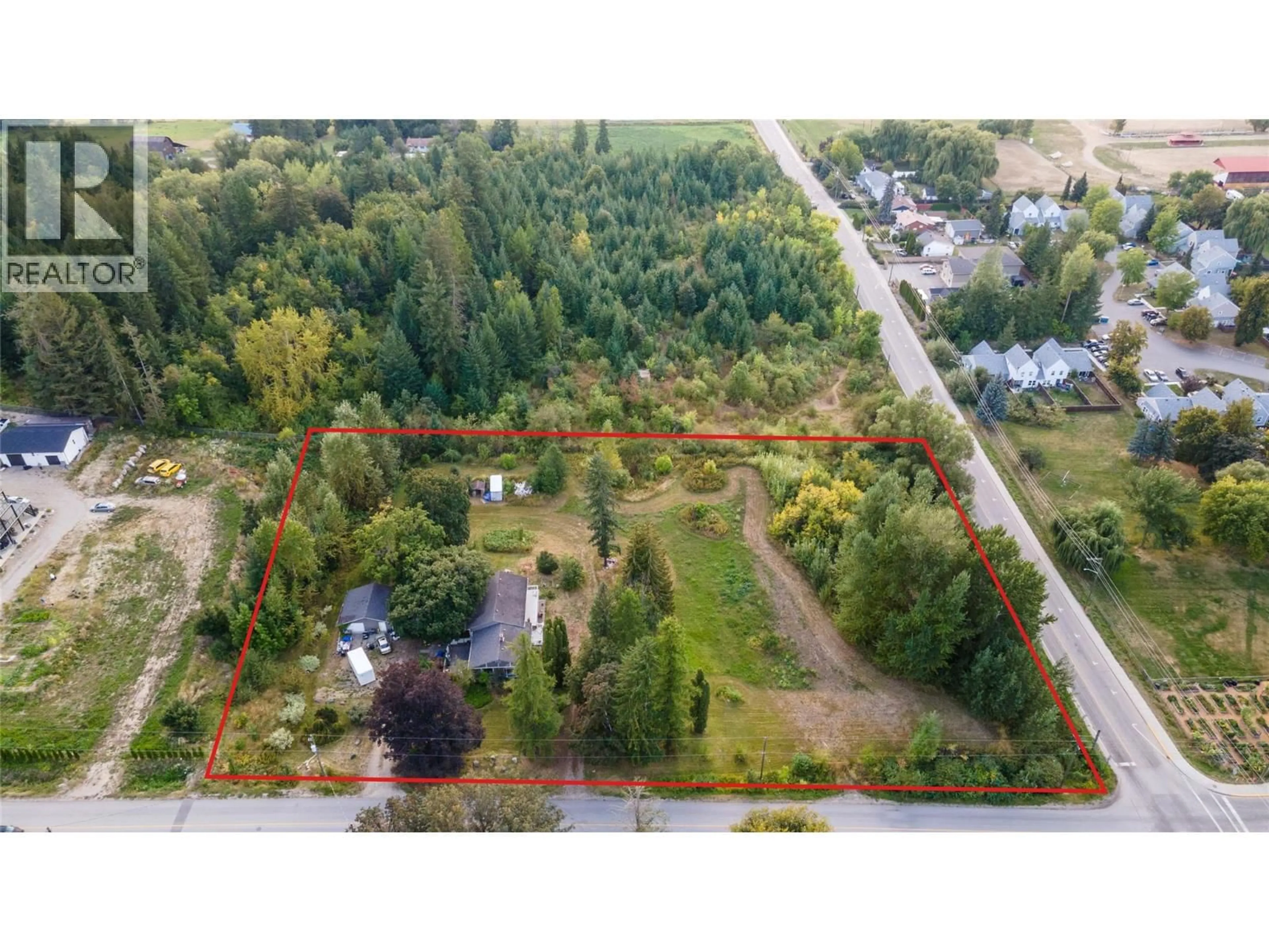 A pic from outside/outdoor area/front of a property/back of a property/a pic from drone, forest/trees view for 1121 SHUSWAP STREET SOUTHWEST, Salmon Arm British Columbia V1E1J3