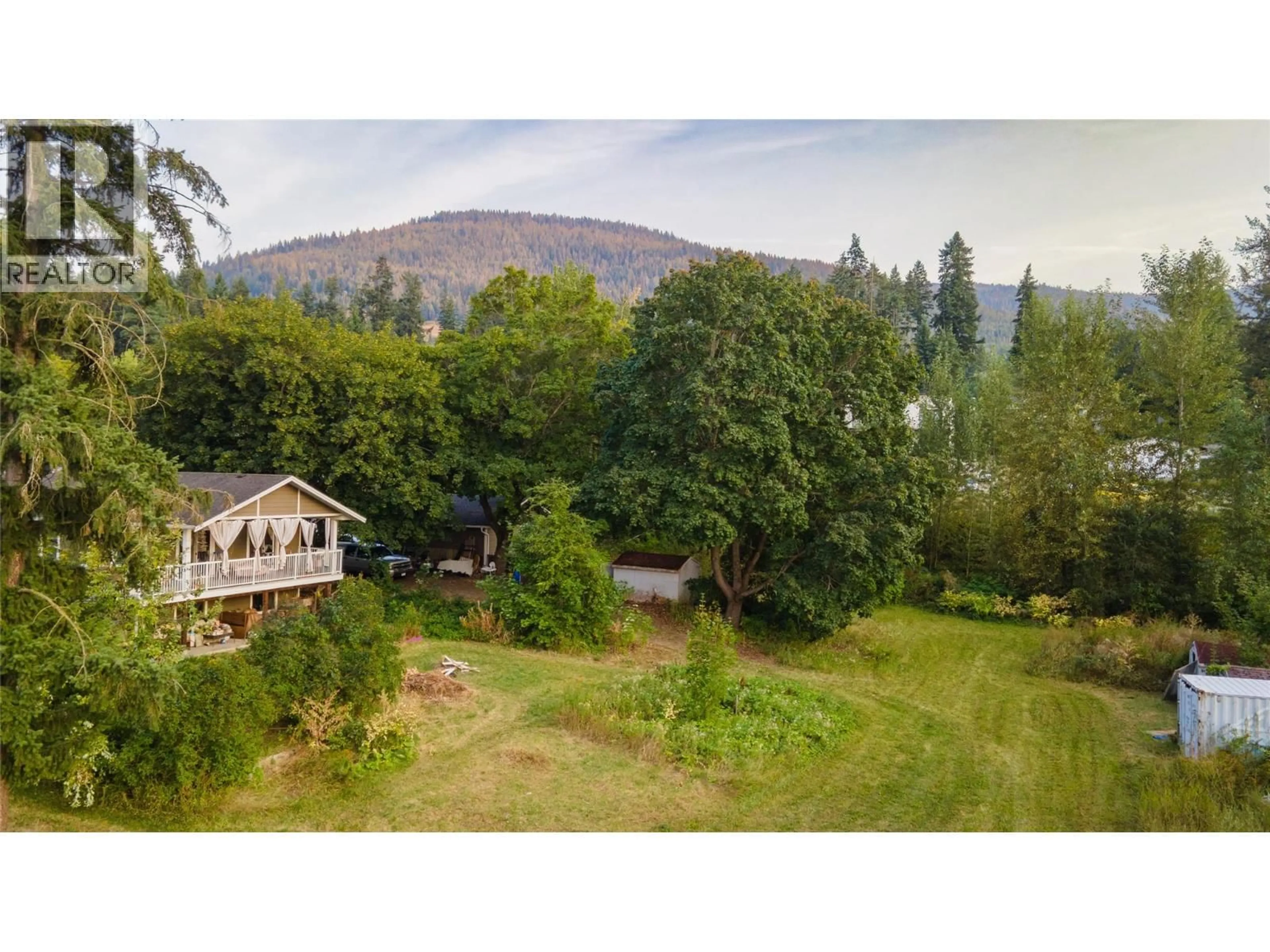 A pic from outside/outdoor area/front of a property/back of a property/a pic from drone, forest/trees view for 1121 SHUSWAP STREET SOUTHWEST, Salmon Arm British Columbia V1E1J3