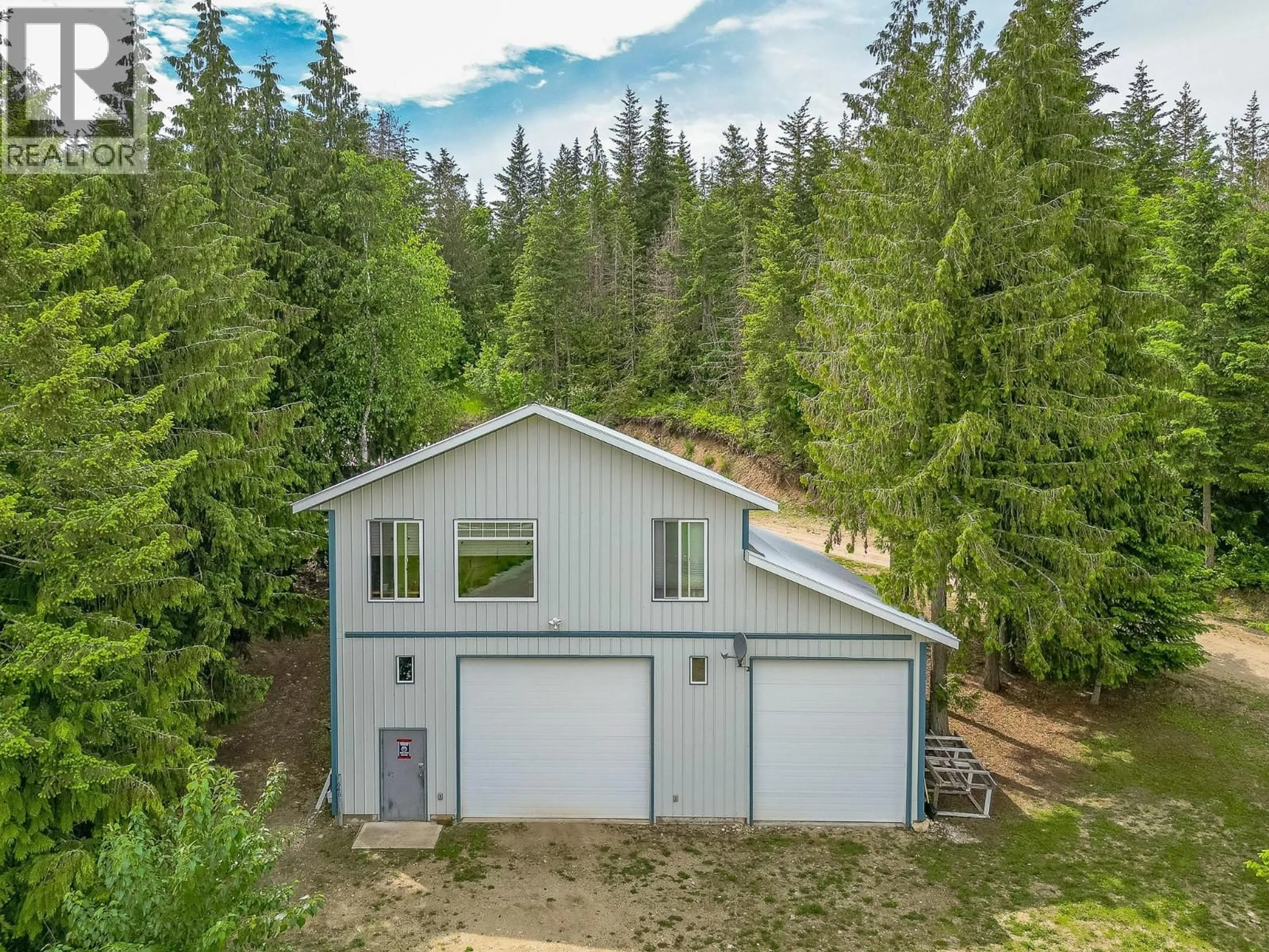 A pic from outside/outdoor area/front of a property/back of a property/a pic from drone, forest/trees view for 645 CAPRI ROAD, Enderby British Columbia V0E1V3