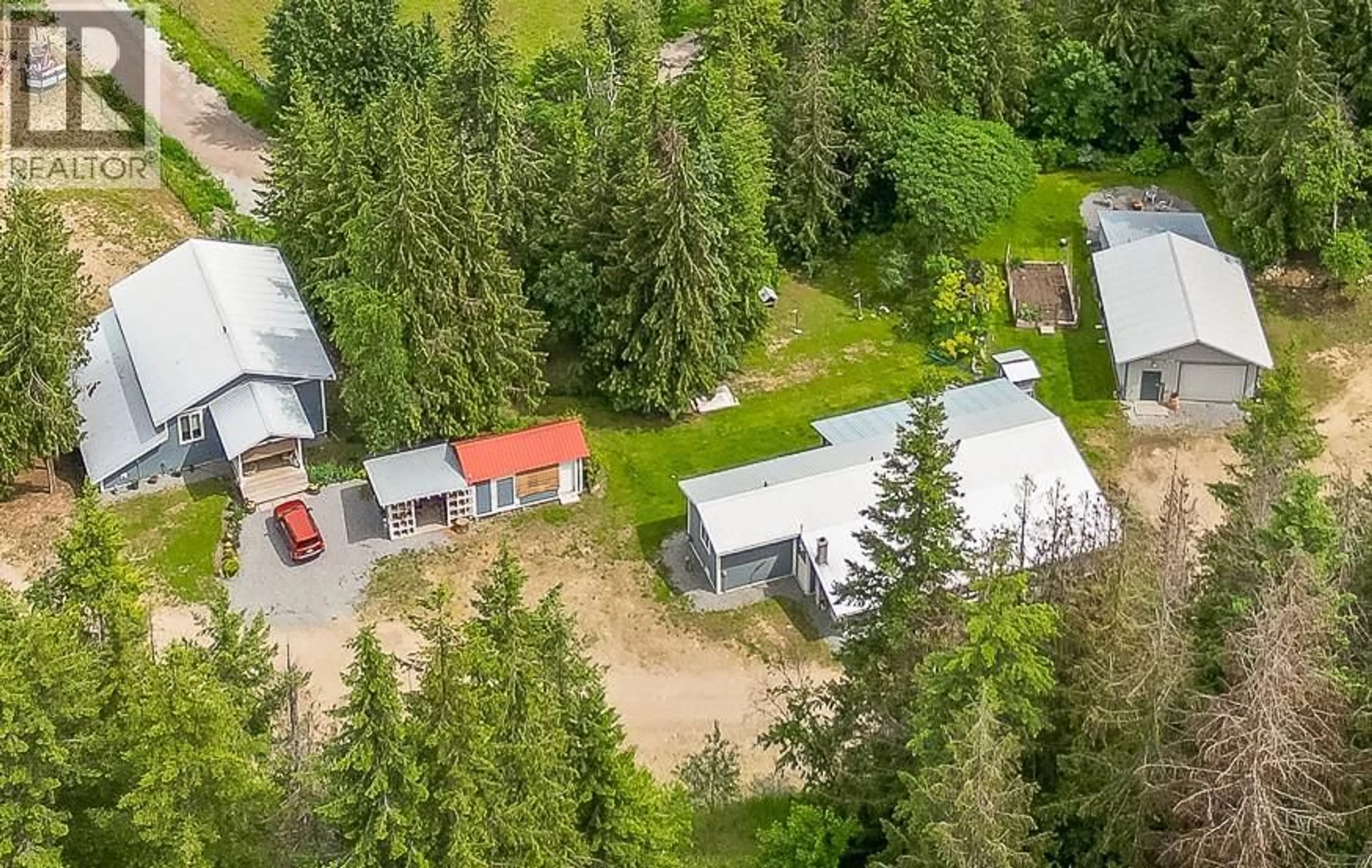 A pic from outside/outdoor area/front of a property/back of a property/a pic from drone, forest/trees view for 645 CAPRI ROAD, Enderby British Columbia V0E1V3