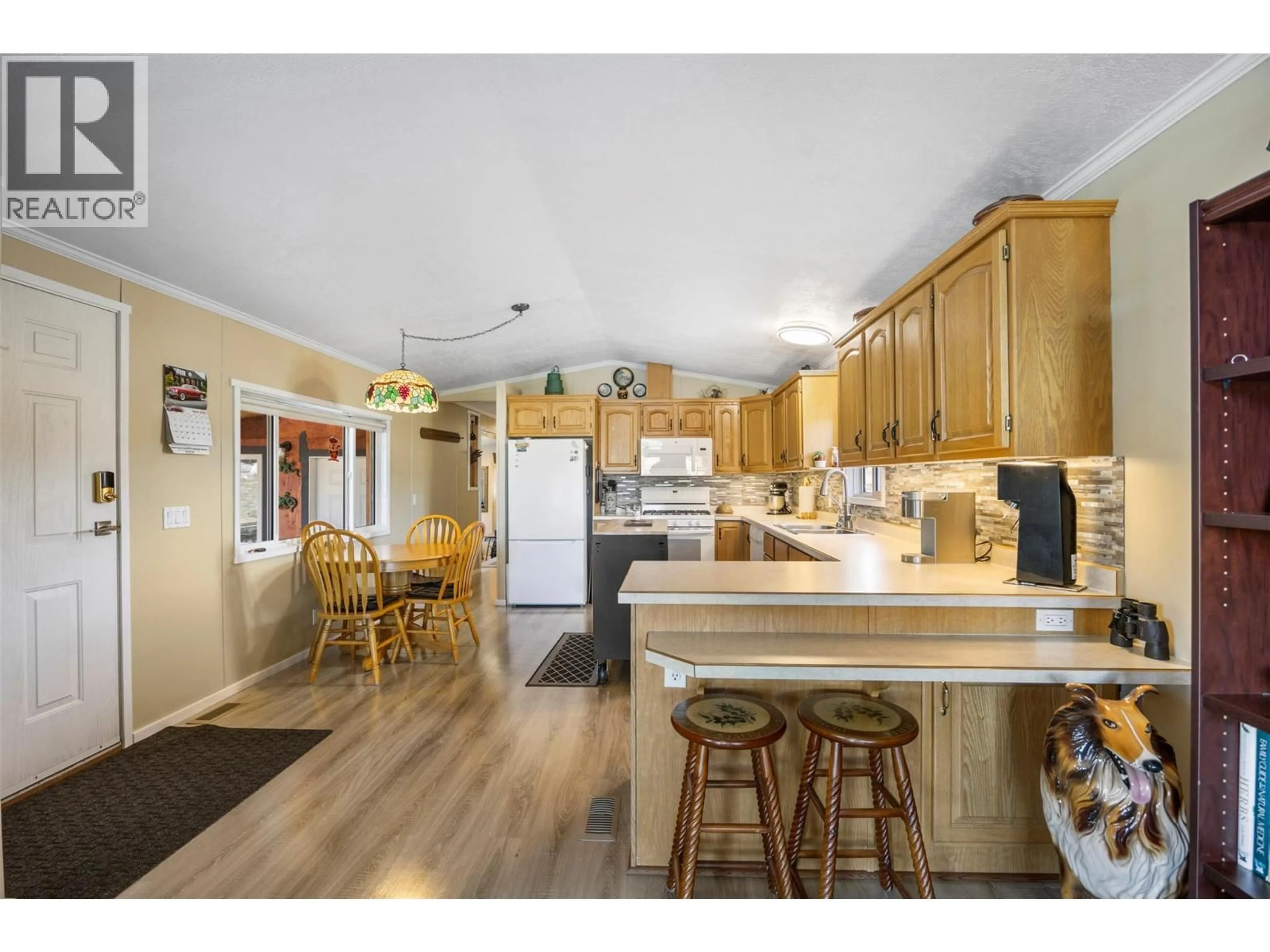 Open concept kitchen, wood/laminate floor for 1832 MOUND-LOON LAKE ROAD, Clinton British Columbia V0K1K0