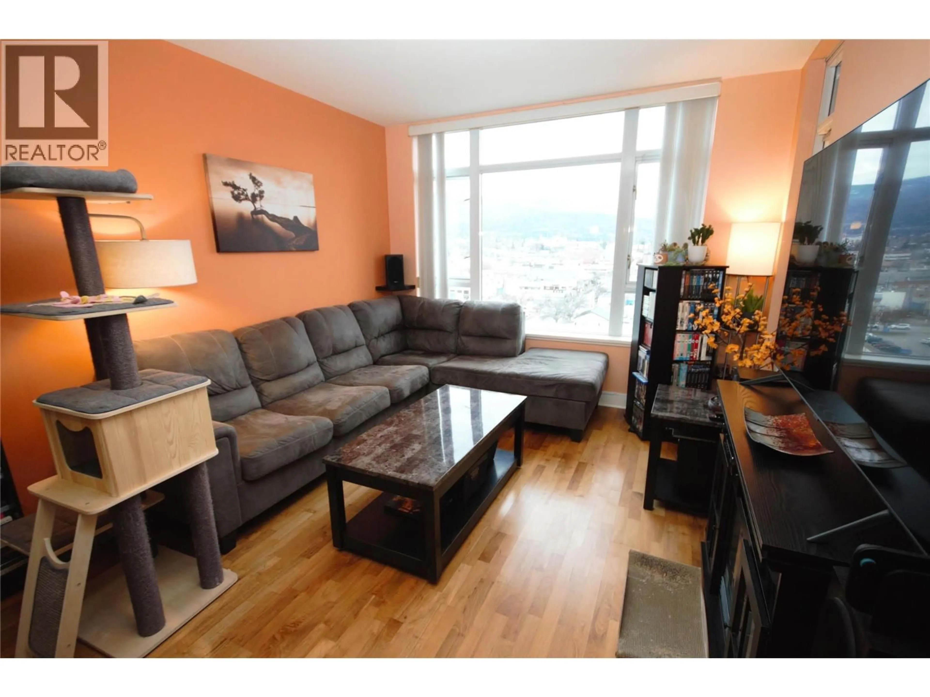 Living room with furniture, wood/laminate floor for 1006 - 75 MARTIN STREET, Penticton British Columbia V2A9C8