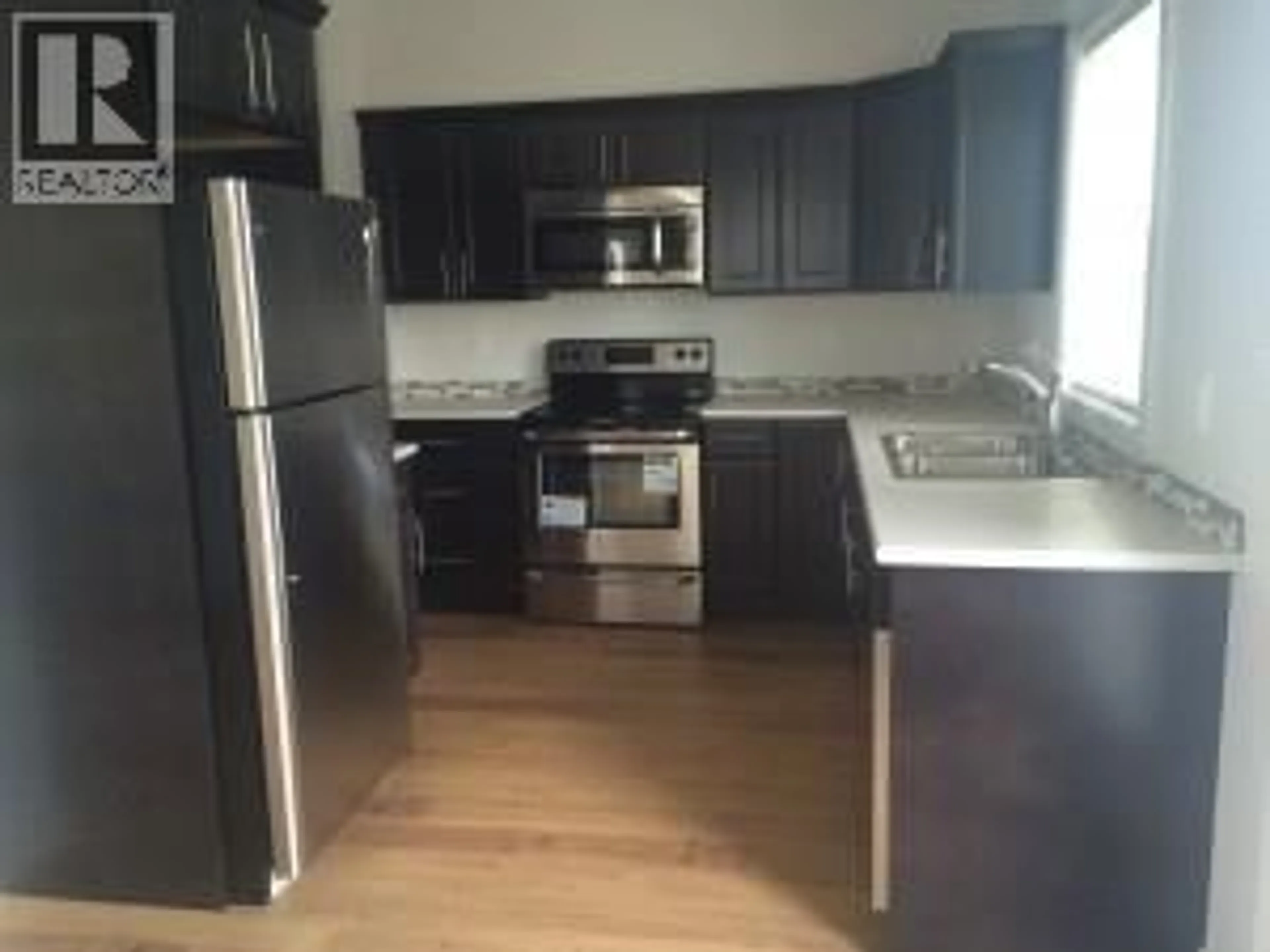 Standard kitchen, wood/laminate floor for 1532 117 AVENUE, Dawson Creek British Columbia V1G0E7