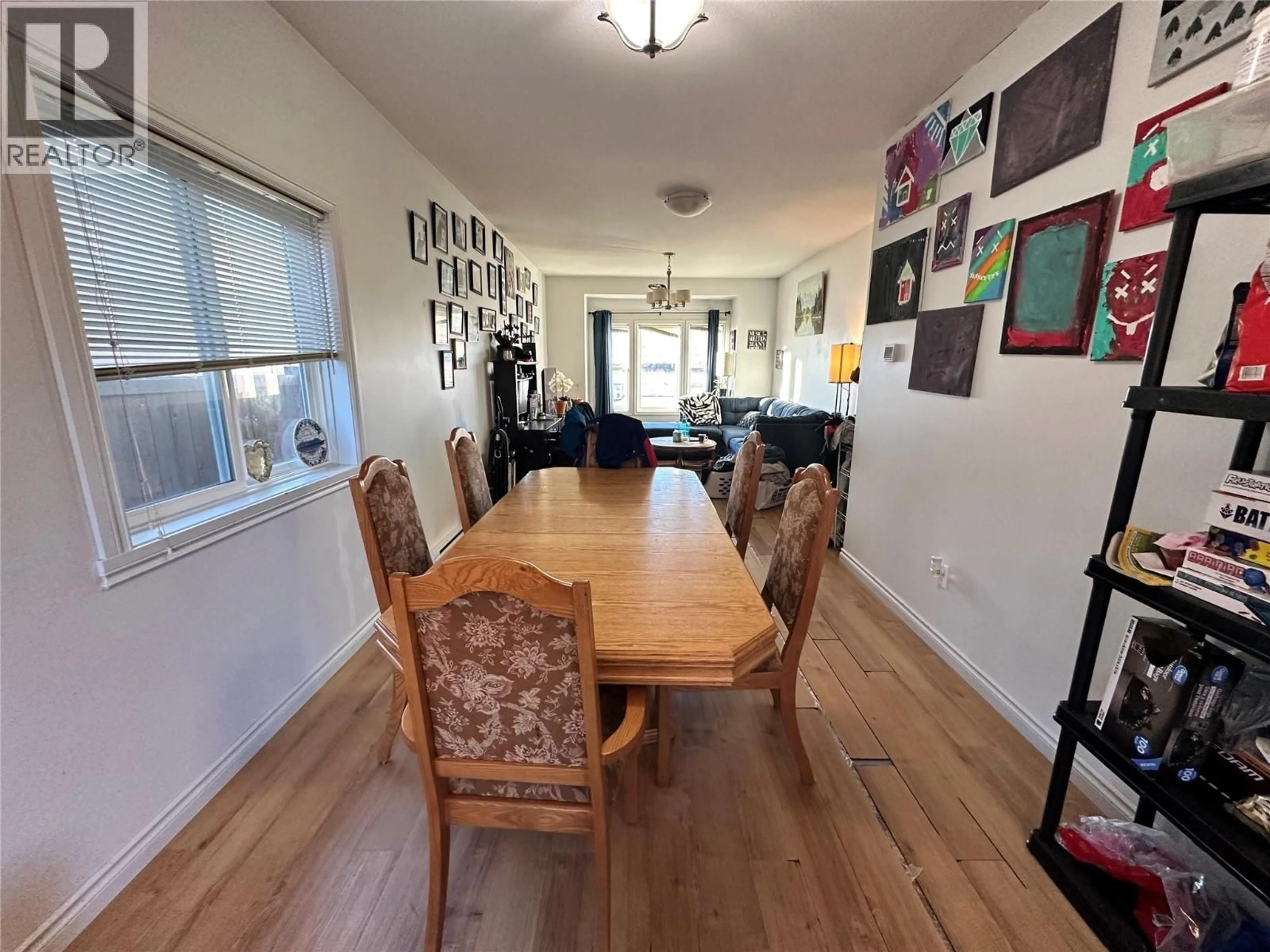 Dining room, wood/laminate floor for 1544 117 AVENUE, Dawson Creek British Columbia V1G0E7