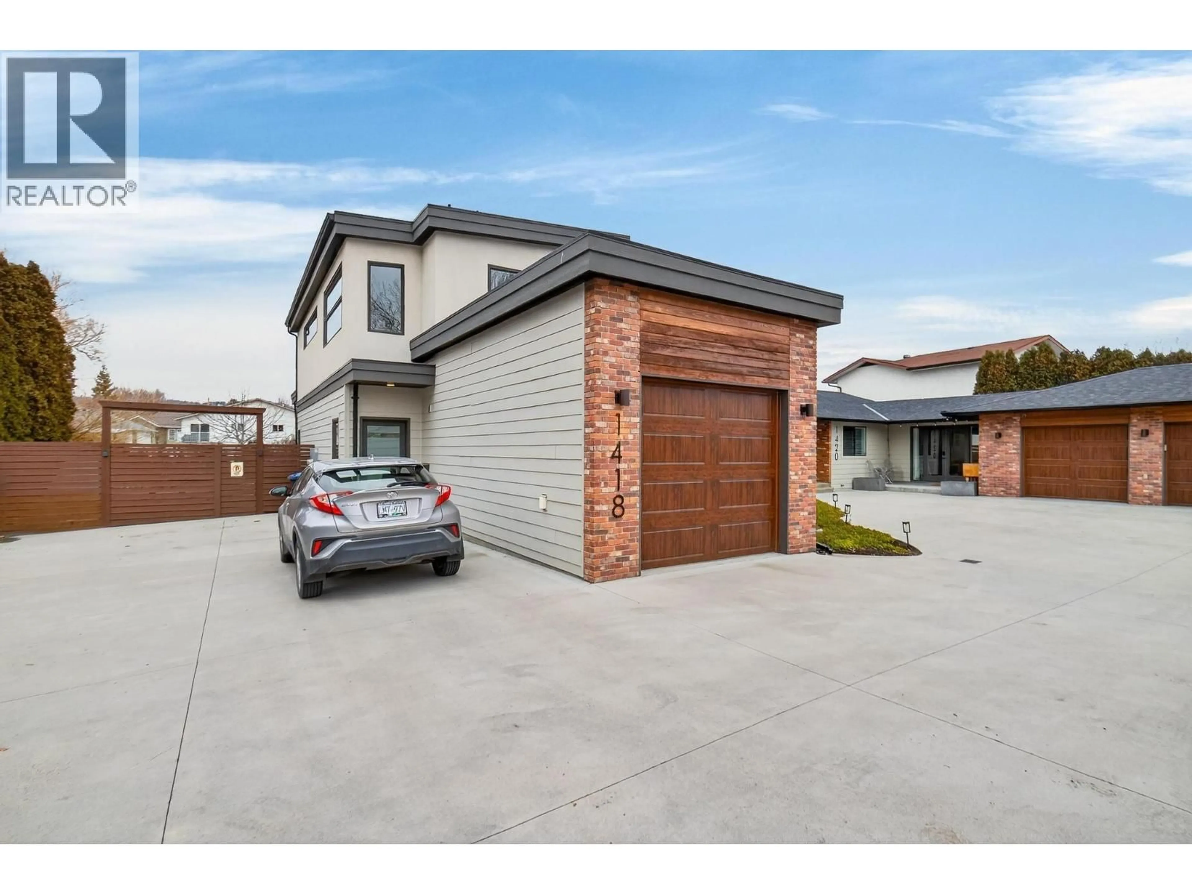 Home with brick exterior material, street for 1418 INKAR ROAD, Kelowna British Columbia V1Y8H7