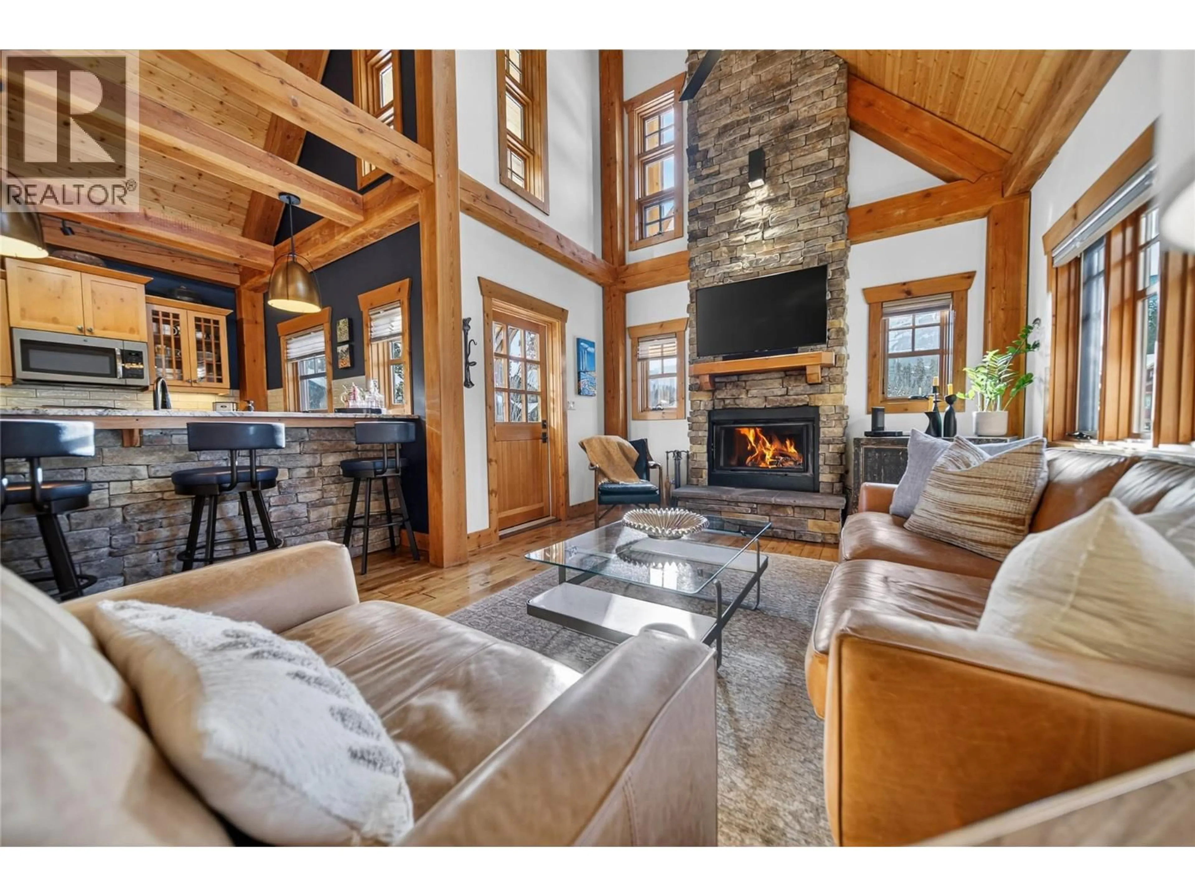 Living room with furniture, wood/laminate floor for 113 KODIAK CRESCENT, Kimberley British Columbia V1A0B2