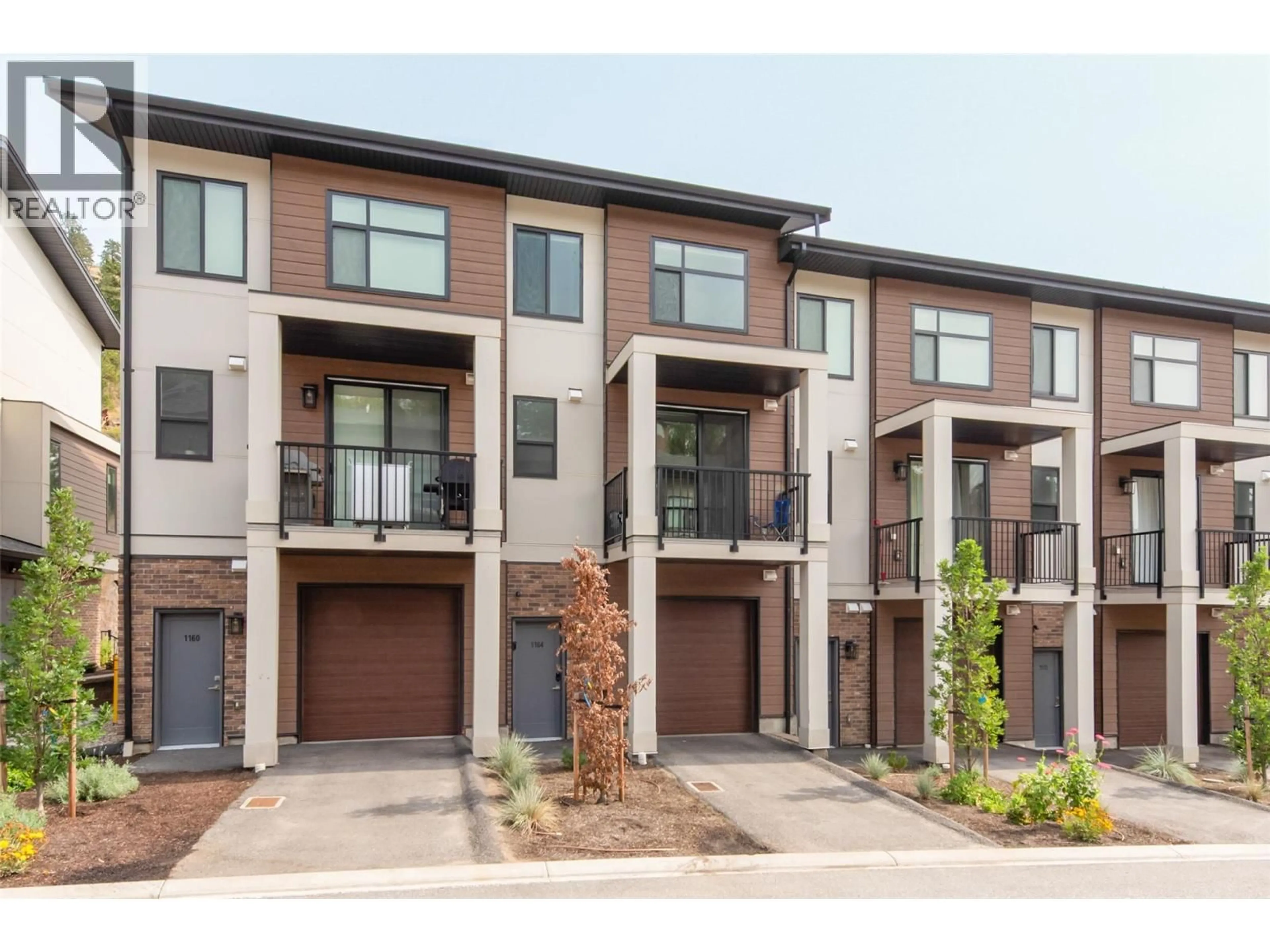 Home with brick exterior material, street for 1164 BLACK MOUNTAIN DRIVE, Kelowna British Columbia V1P0A7