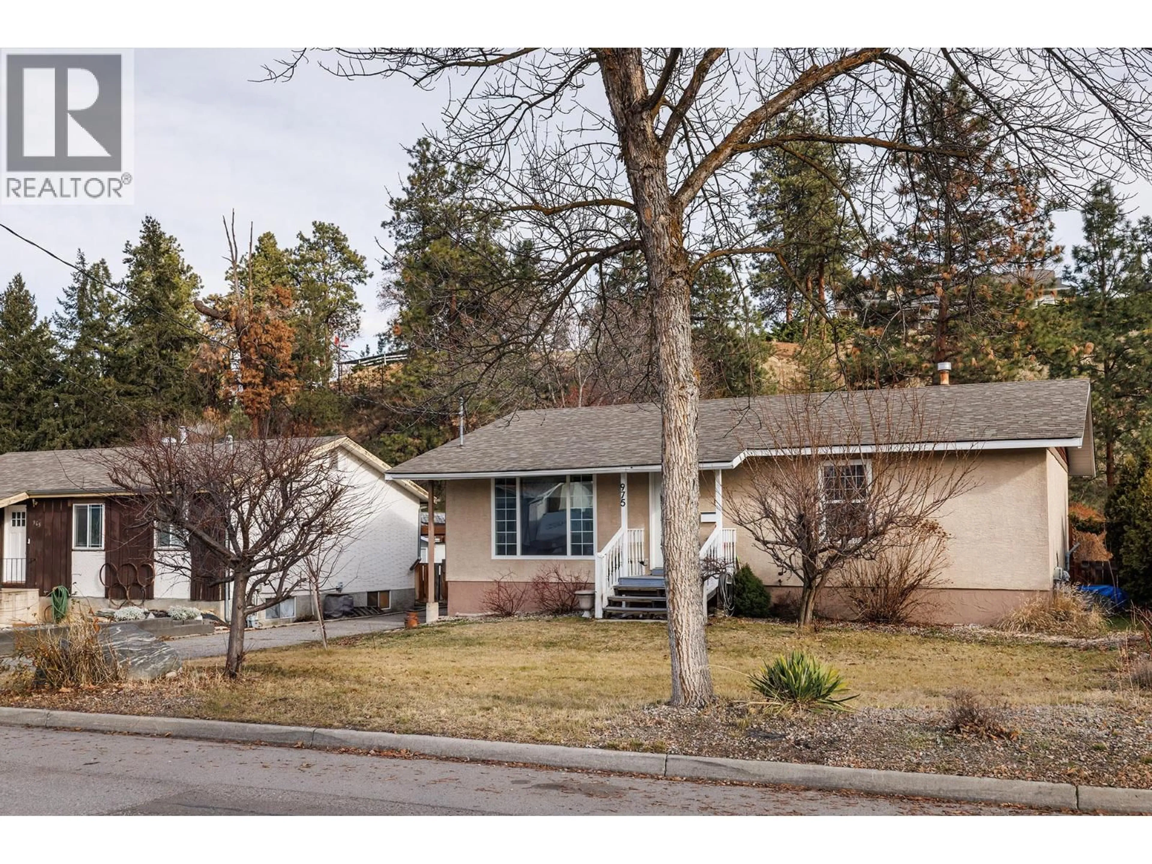 Home with vinyl exterior material, street for 975 NEPTUNE ROAD, Kelowna British Columbia V1X3E4