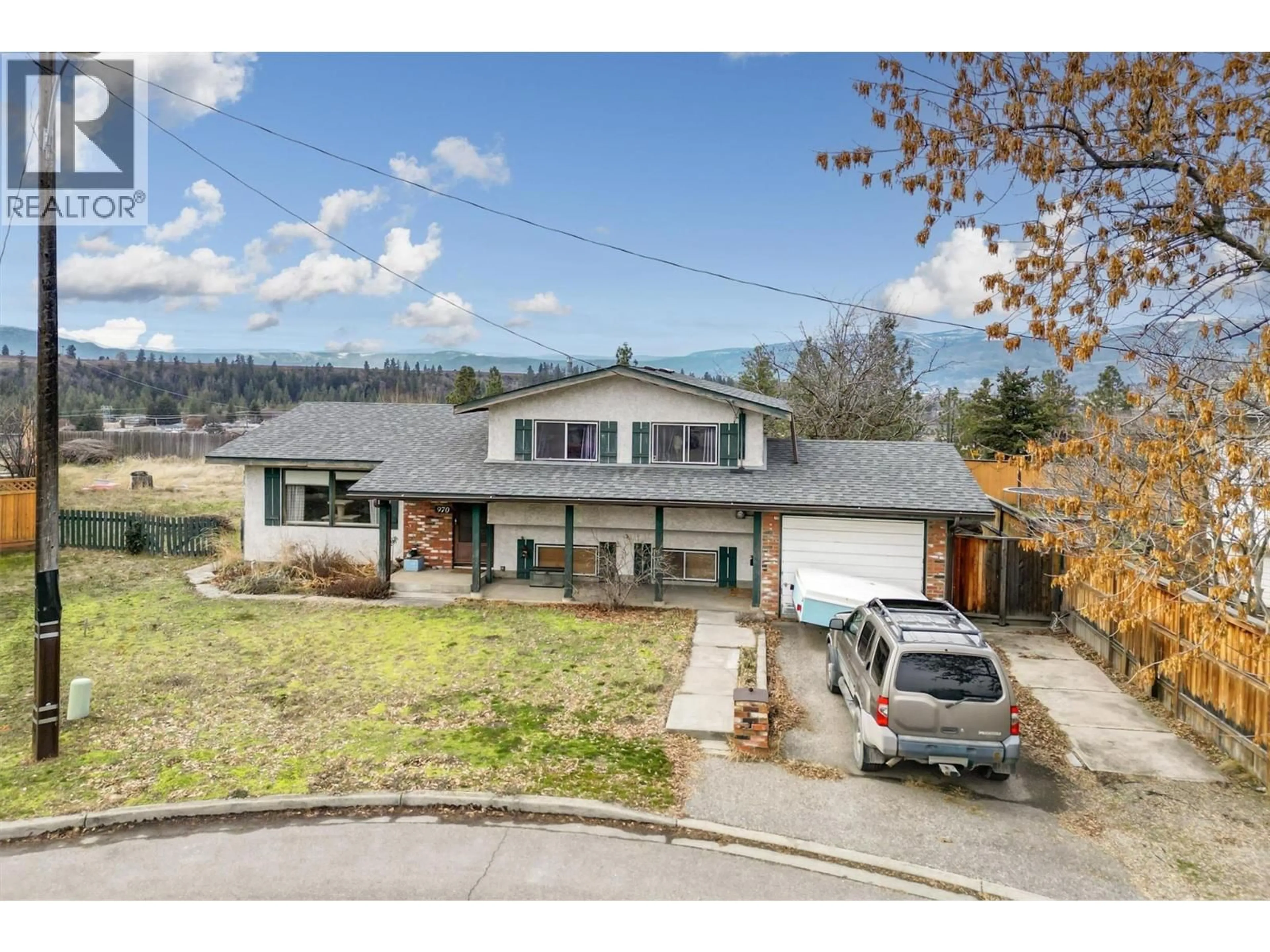 A pic from outside/outdoor area/front of a property/back of a property/a pic from drone, street for 970 TAURUS ROAD, Kelowna British Columbia V1X5G3