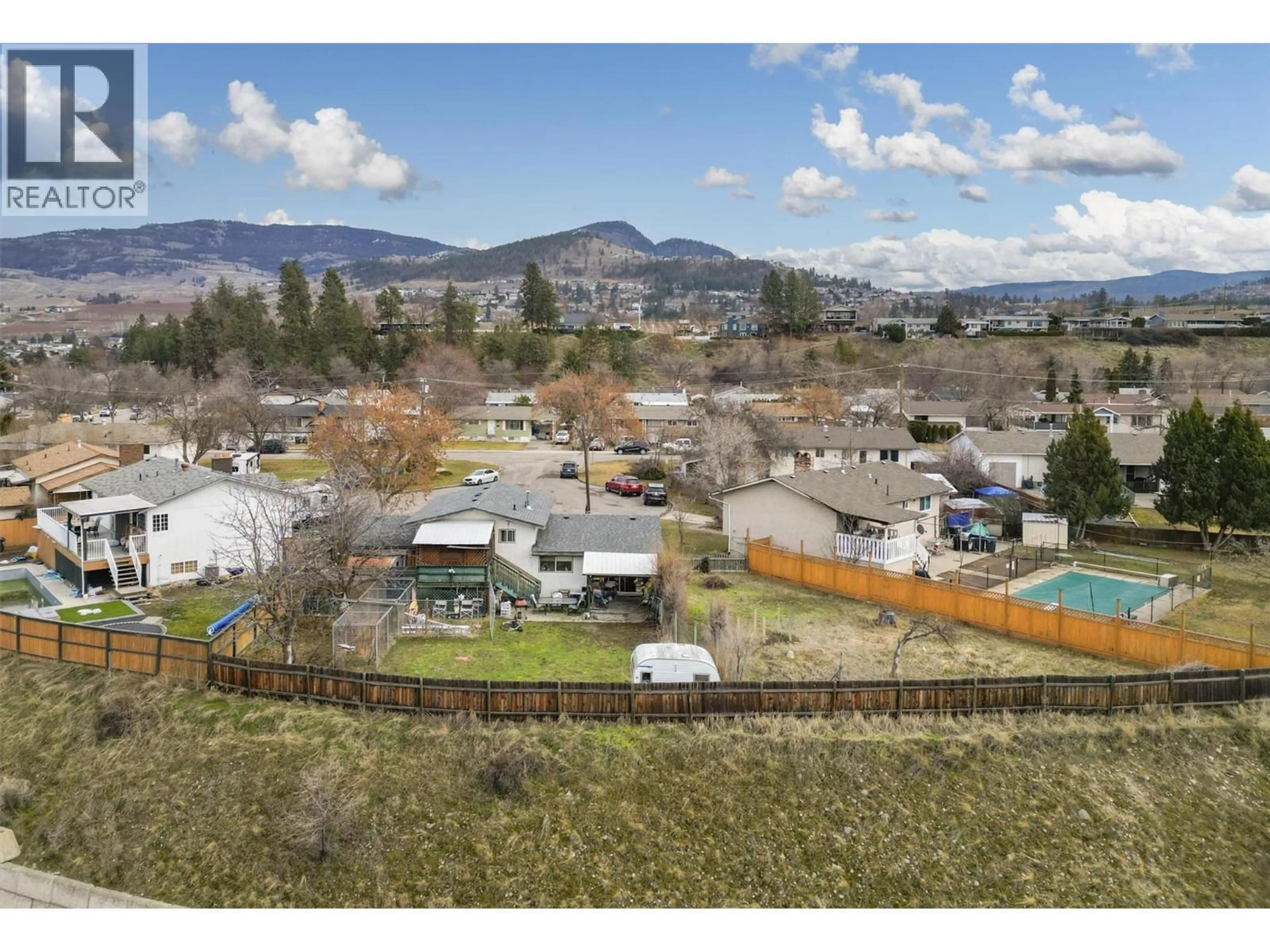 A pic from outside/outdoor area/front of a property/back of a property/a pic from drone, mountain view for 970 TAURUS ROAD, Kelowna British Columbia V1X5G3