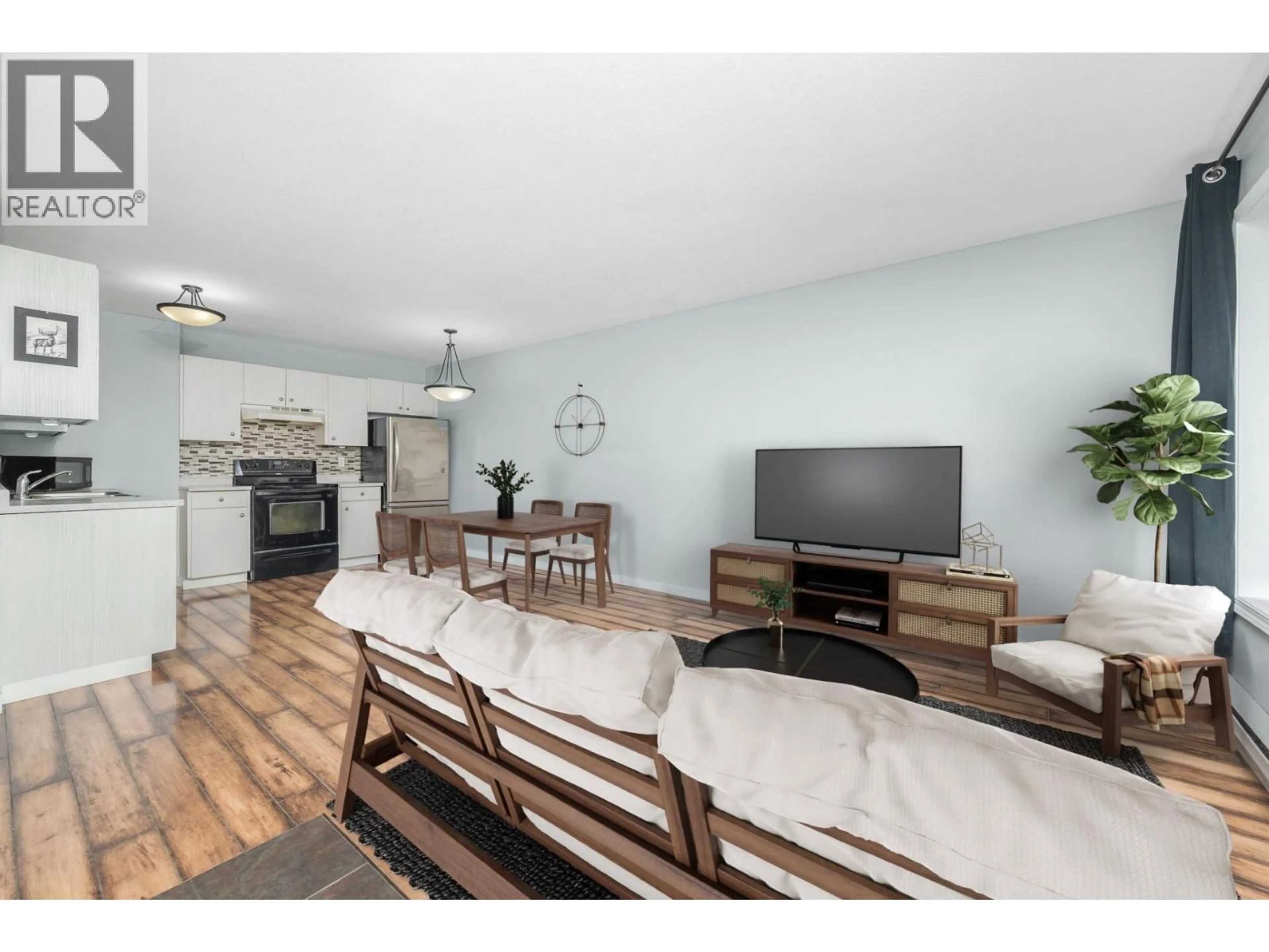 Living room with furniture, wood/laminate floor for 109 - 1047 MIDDLETON WAY, Vernon British Columbia V1B2N3