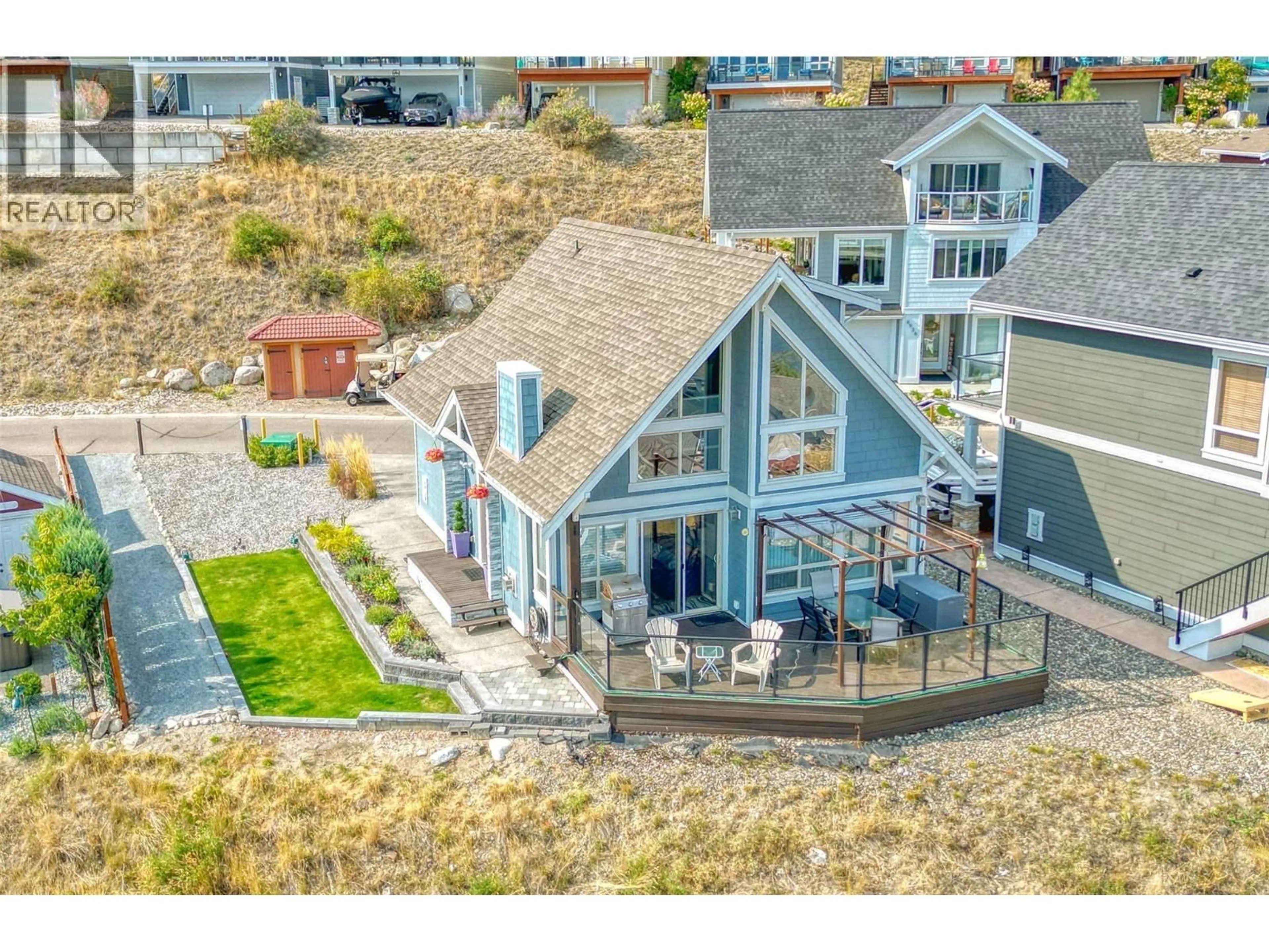 A pic from outside/outdoor area/front of a property/back of a property/a pic from drone, water/lake/river/ocean view for 64 - 6933 BARCELONA DRIVE, Kelowna British Columbia V1Z3R8